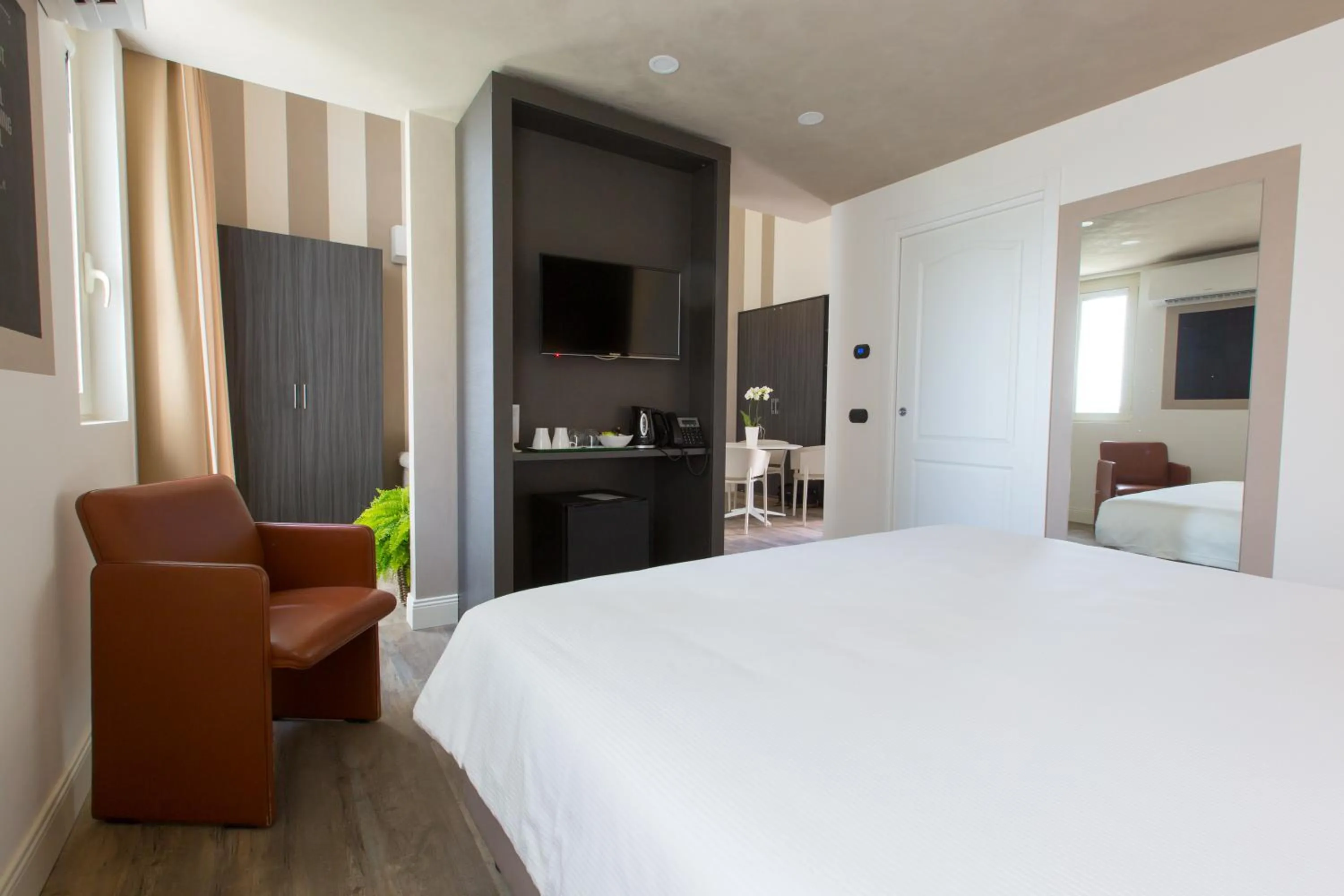 Photo of the whole room, Bed in Hotel Al Campanile - Luxury Suites & Apartments