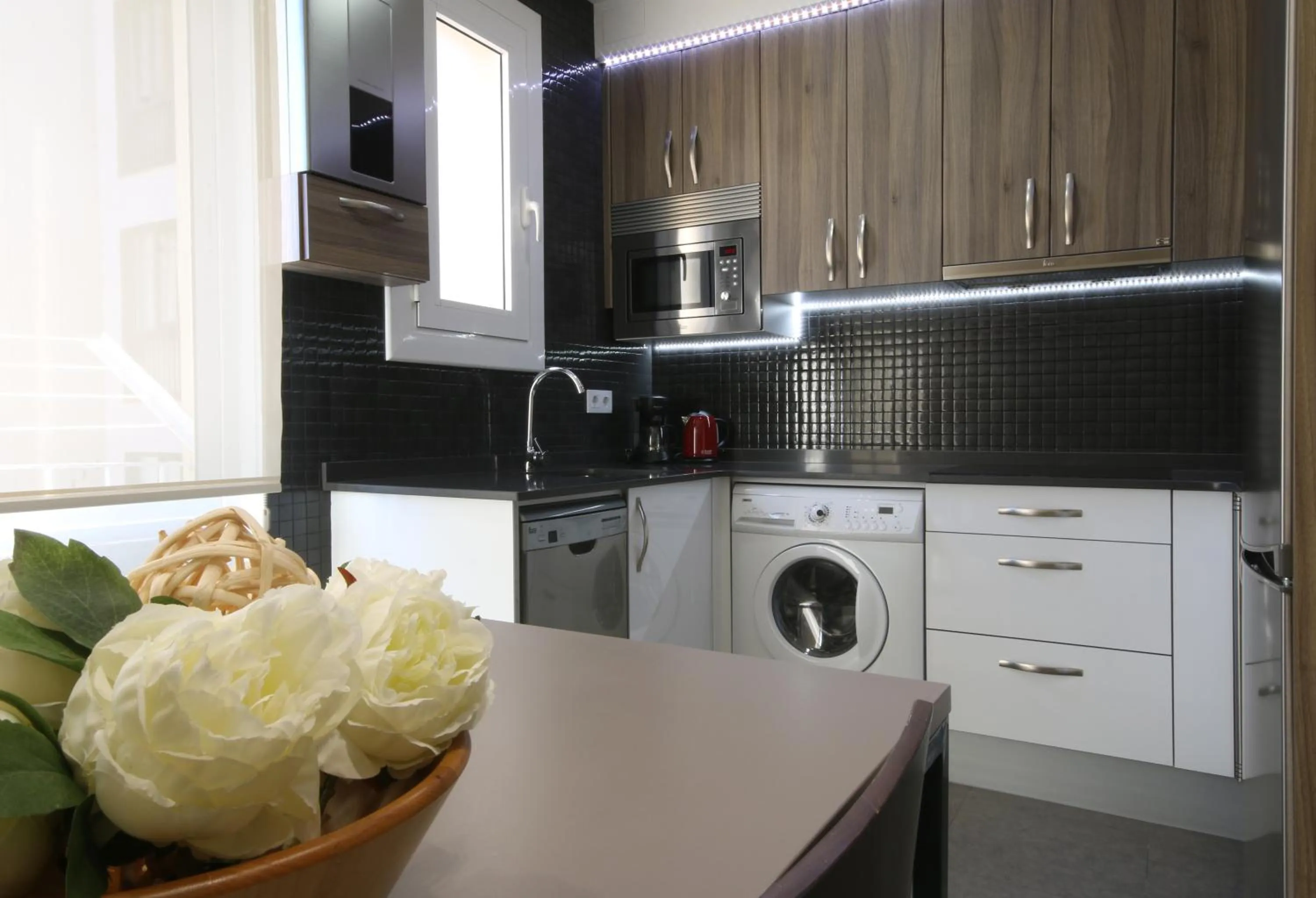 Kitchen or kitchenette in Suite Place Barcelona Còrsega