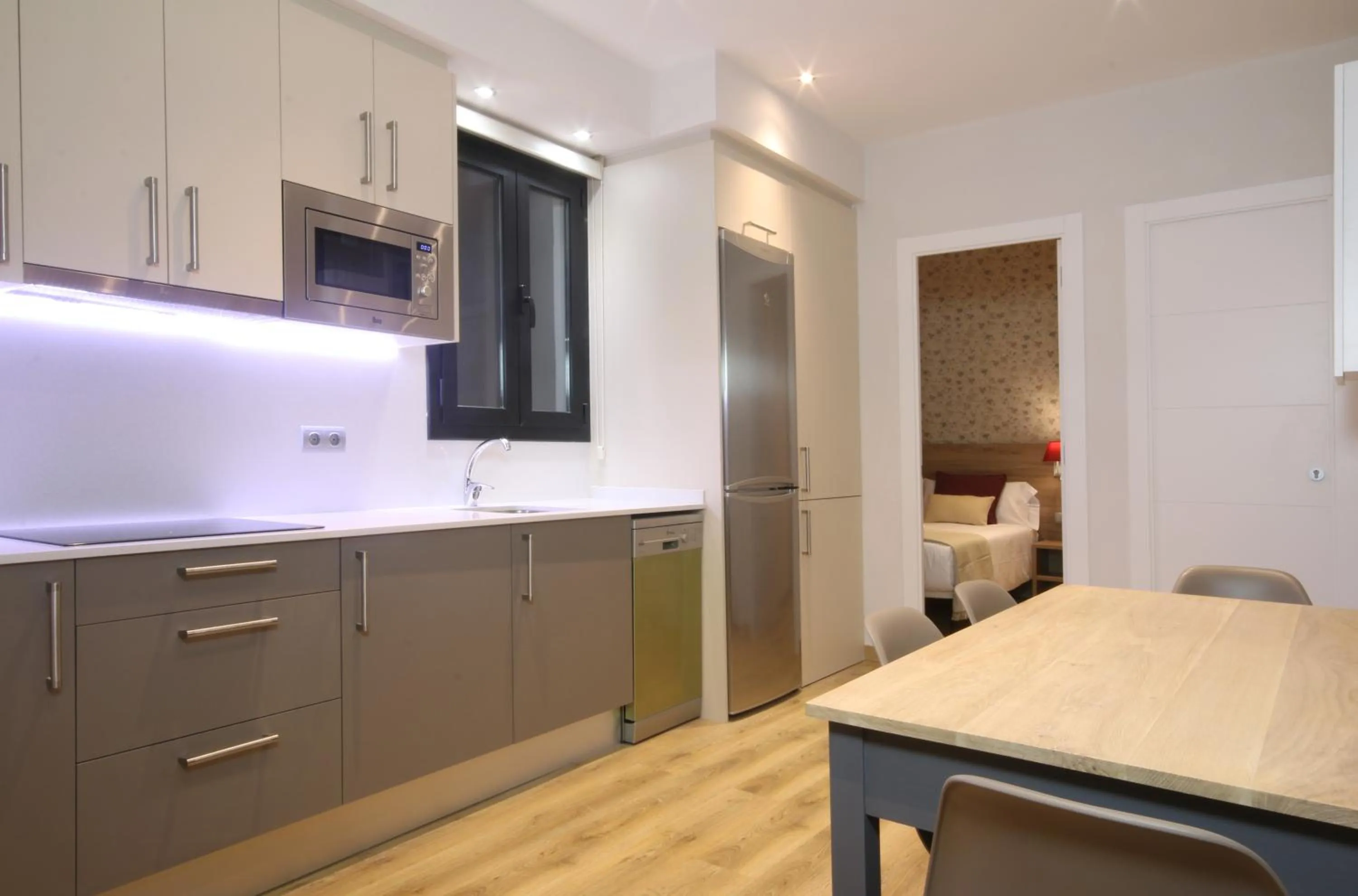 Kitchen or kitchenette in Suite Place Barcelona Còrsega