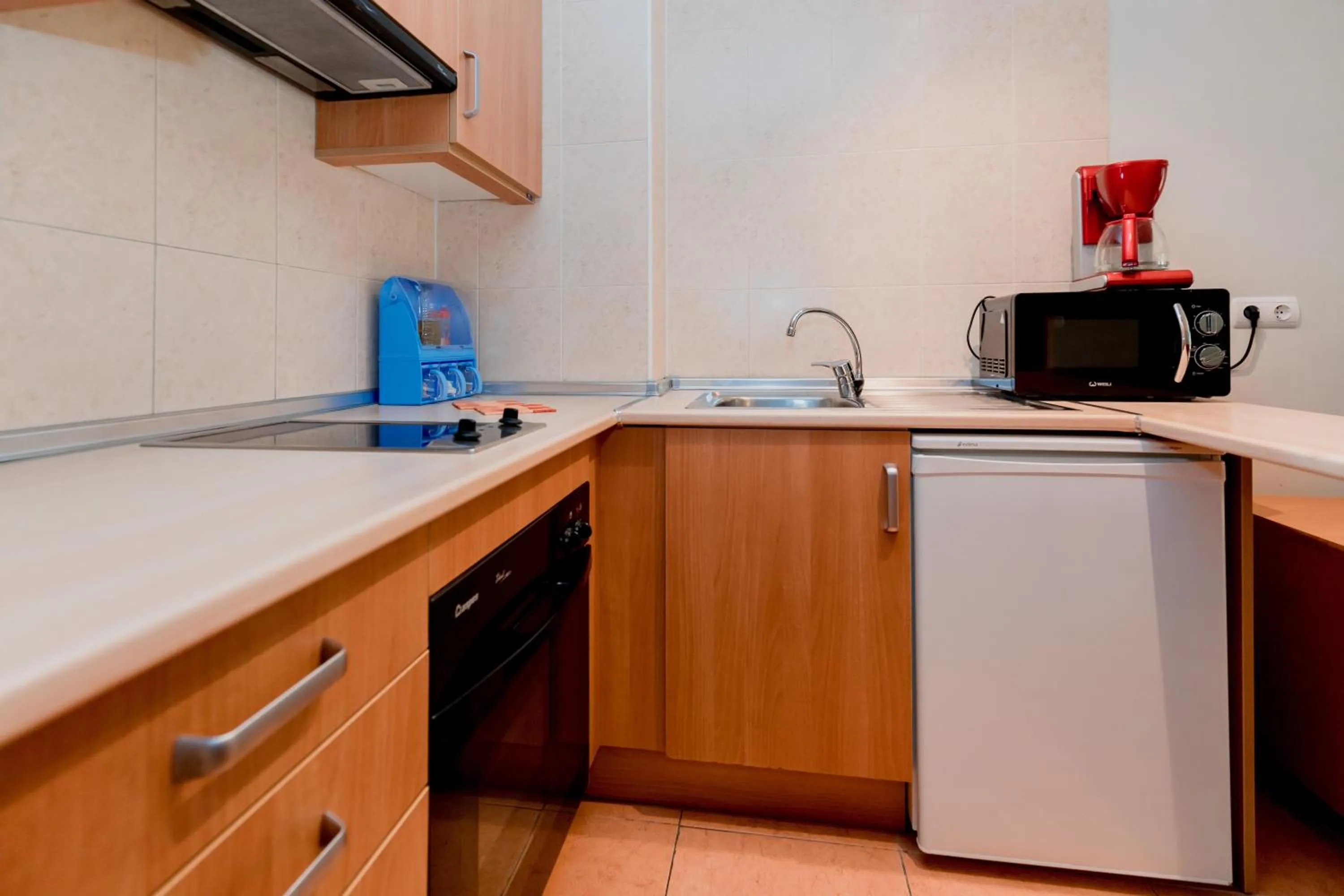 Kitchen or kitchenette in Pierre & Vacances Aparthotel La Tulipa