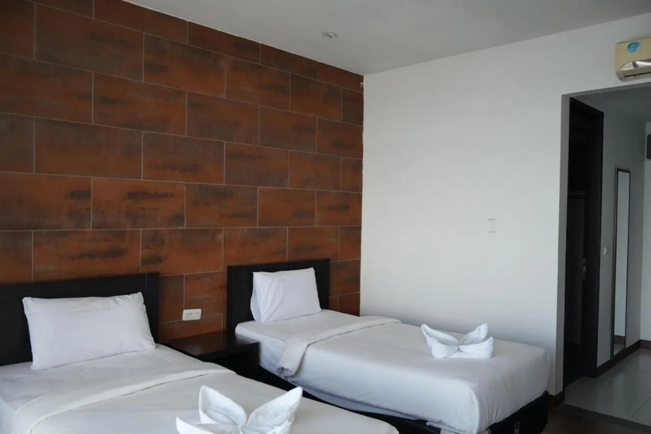 Bed in Tiara Bunga Hotel & Villa