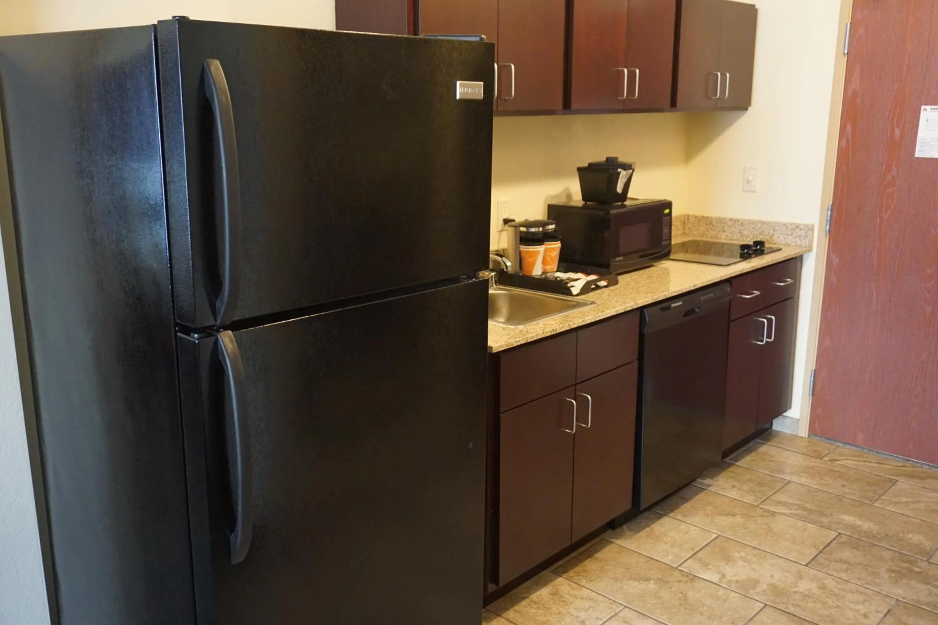 Kitchen or kitchenette in Cobblestone Hotel & Suites - Chippewa Falls