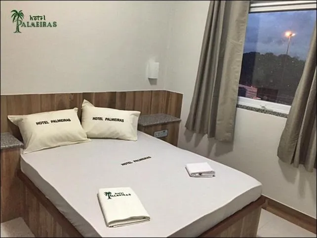 Bed in Hotel Palmeiras Ltda