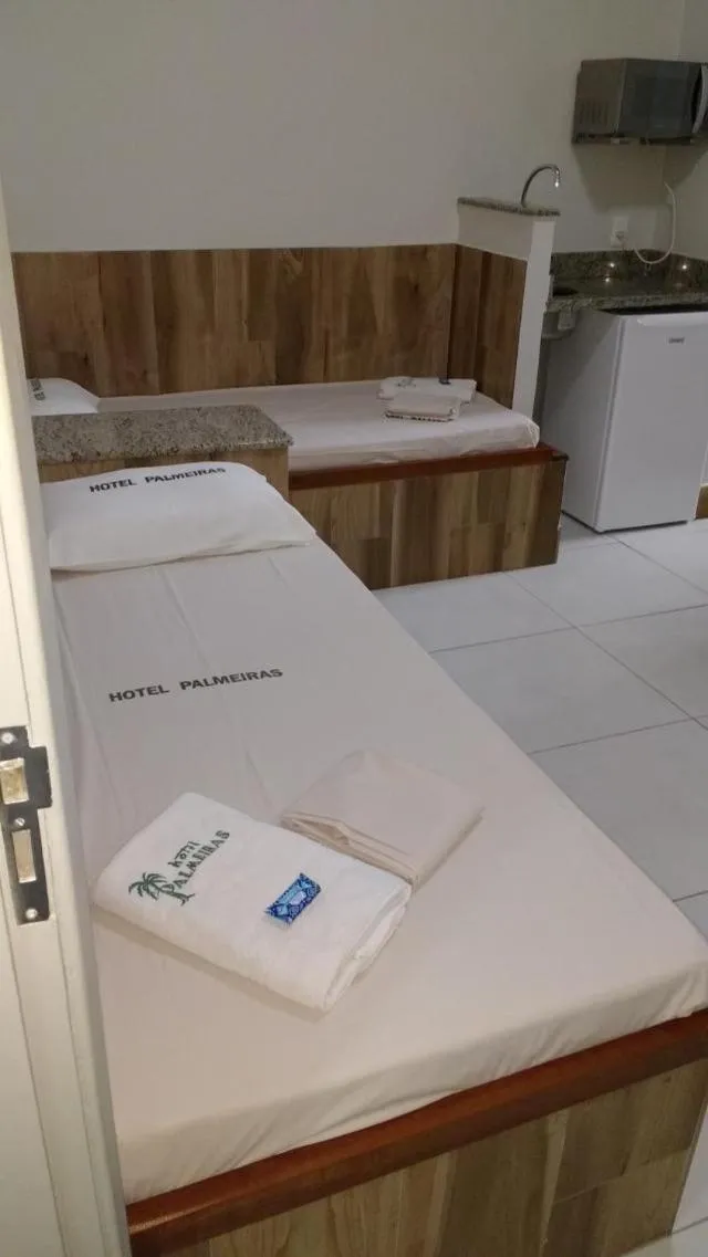 Bed in Hotel Palmeiras Ltda