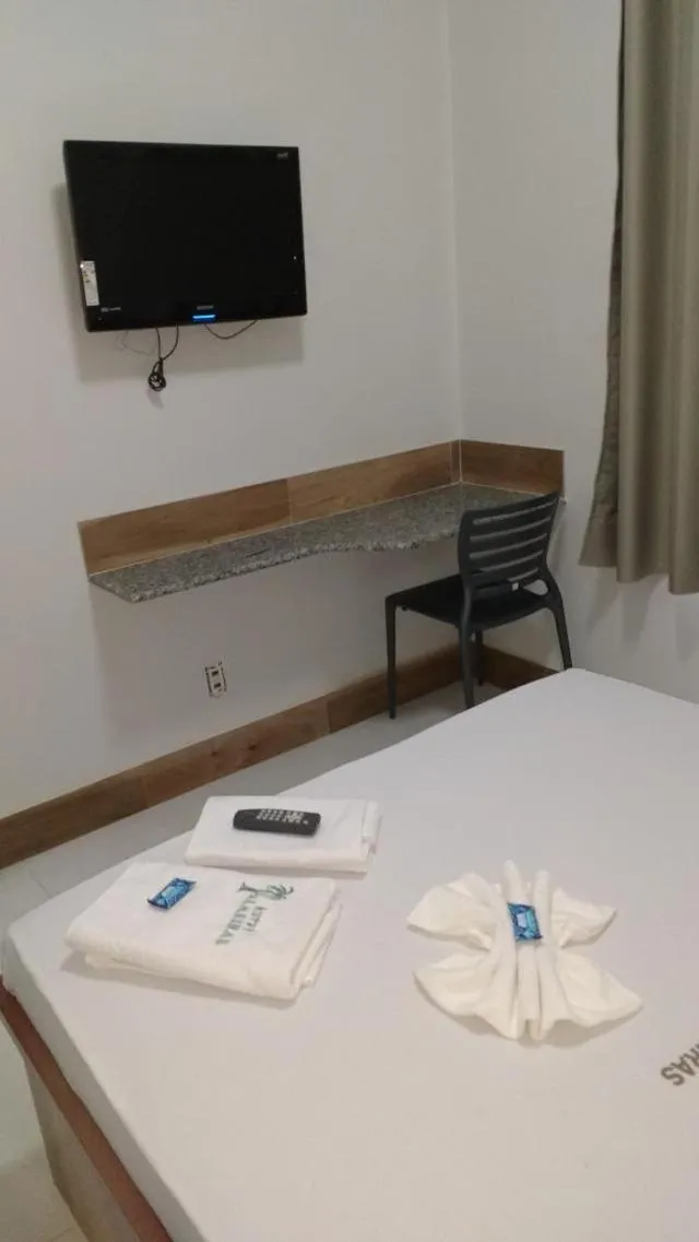 Bed in Hotel Palmeiras Ltda