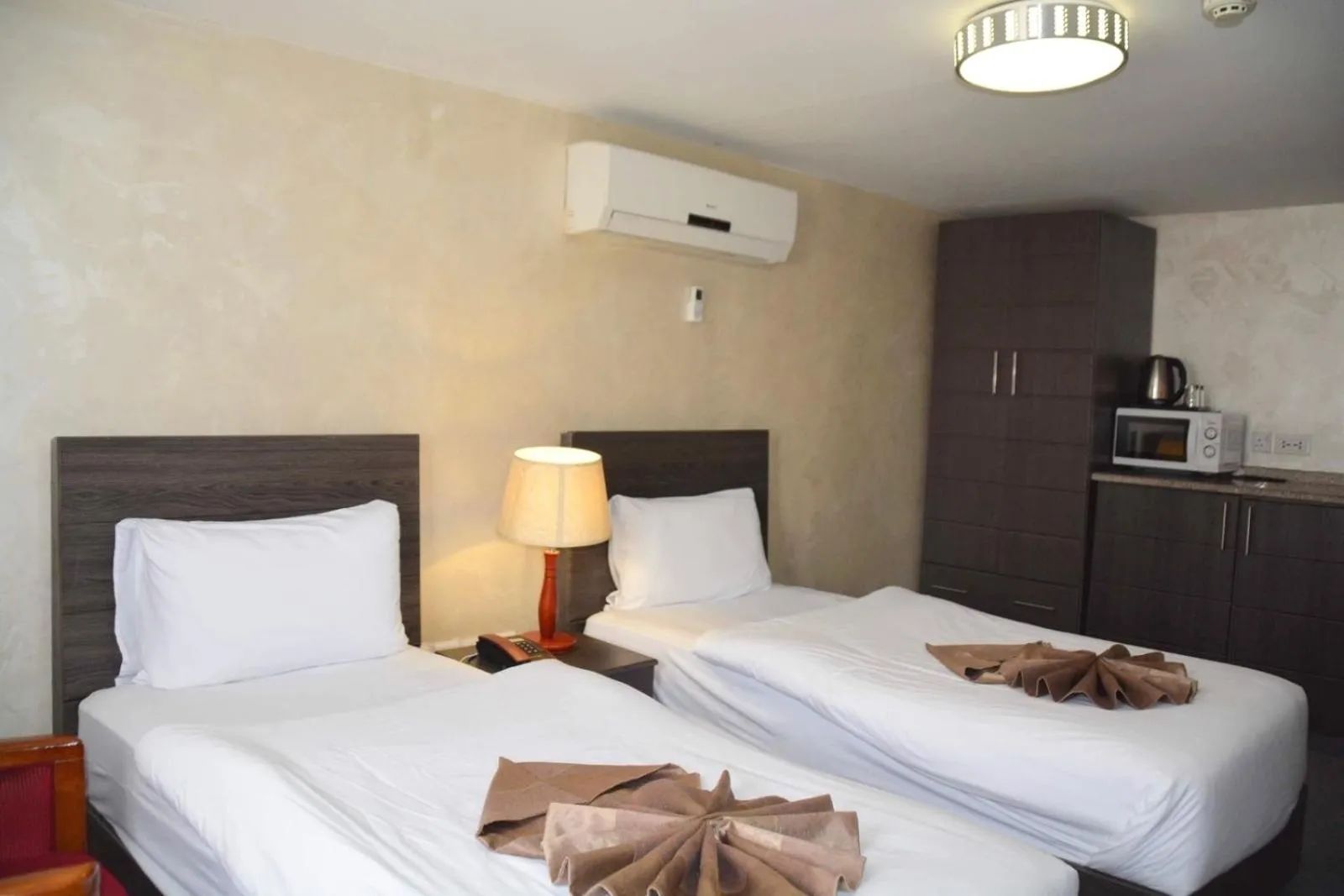 Bed in Olive Hotel Amman