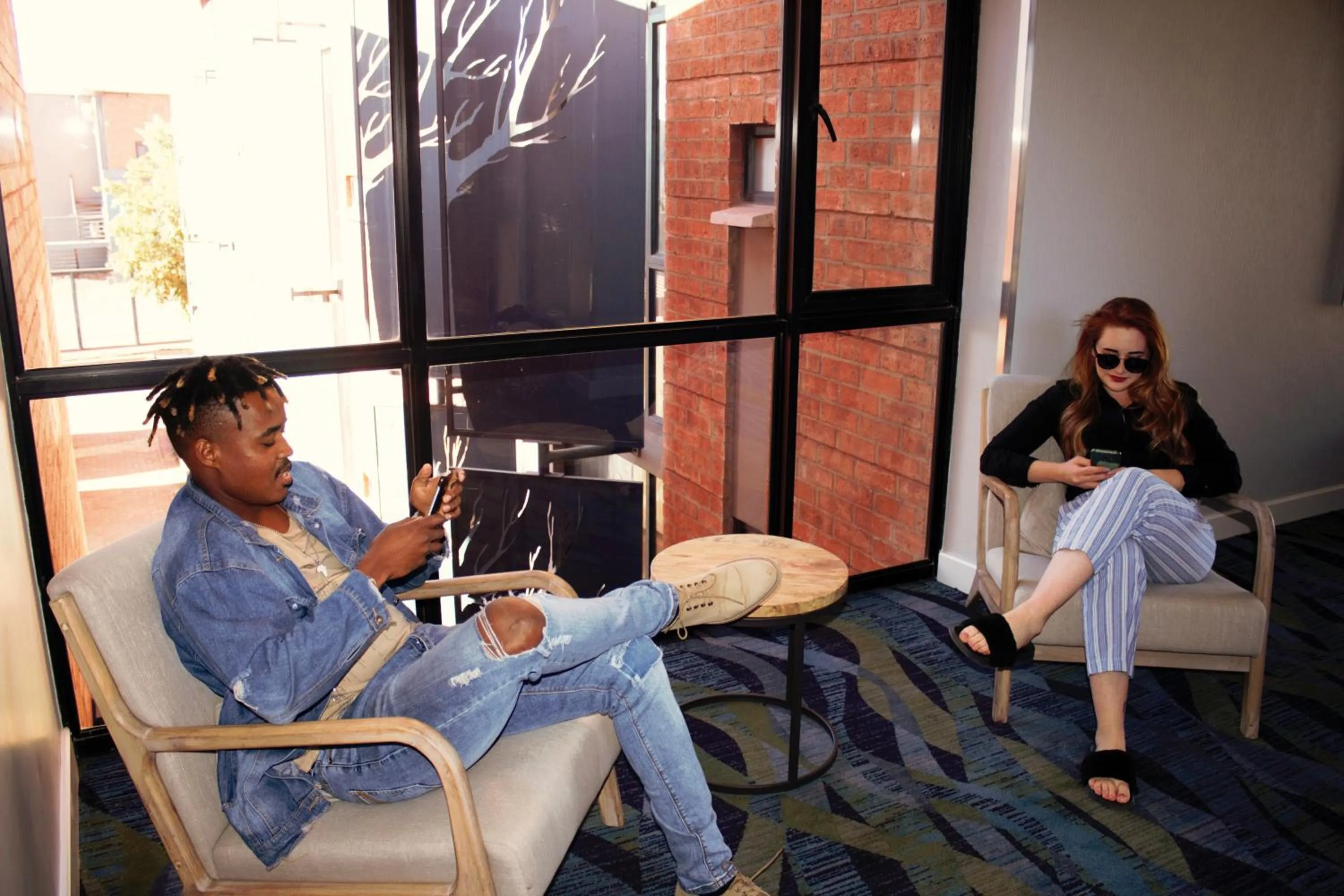 Communal lounge/ TV room in aha Kathu Hotel