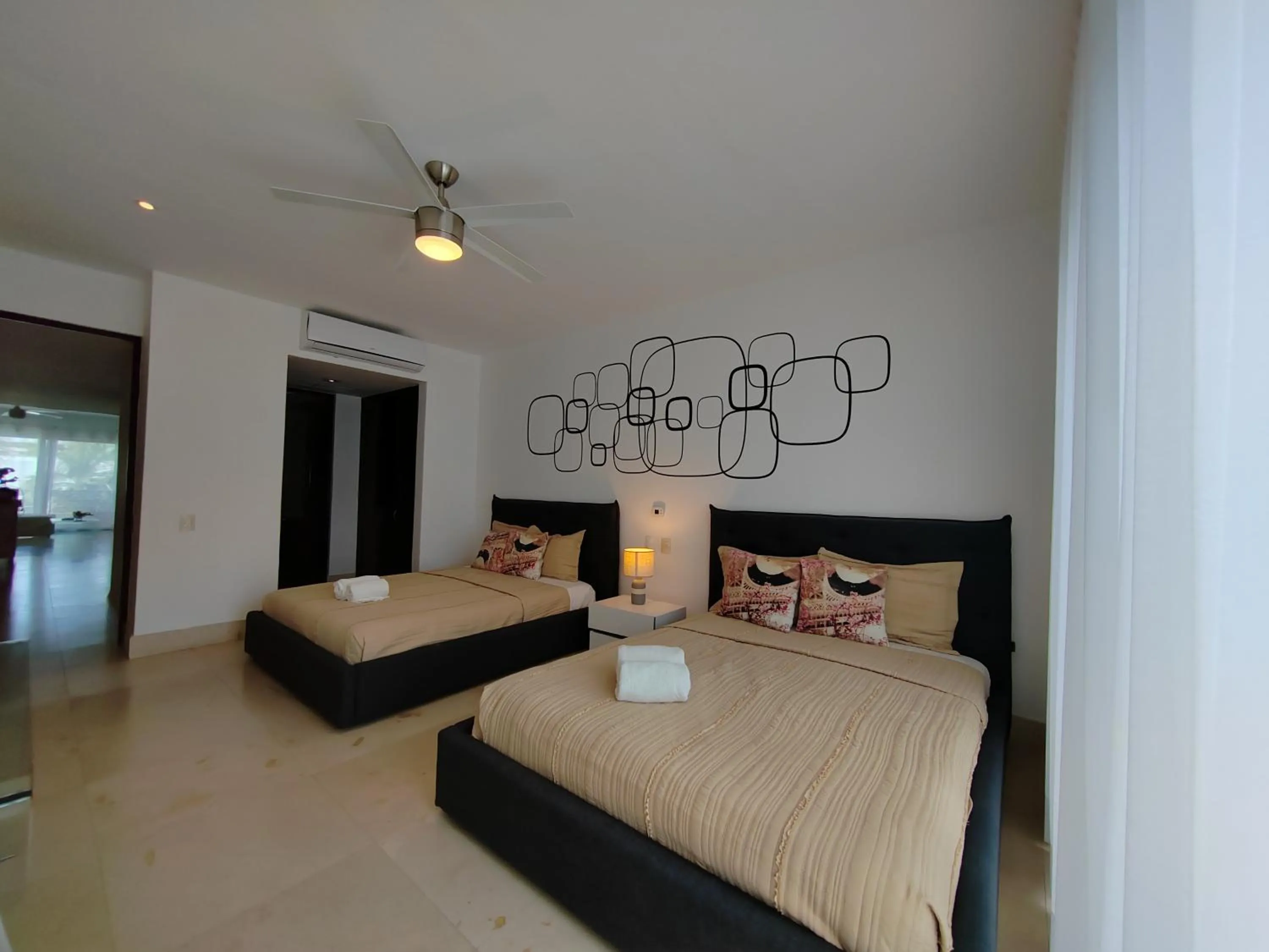 Bed in Luxurious & Central Condo In Playa Steps From The Beach