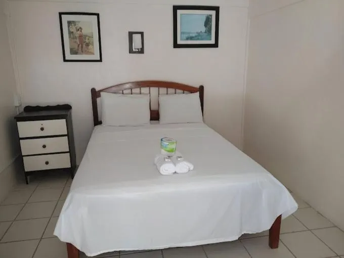 Bed in Blue Wave Guest House