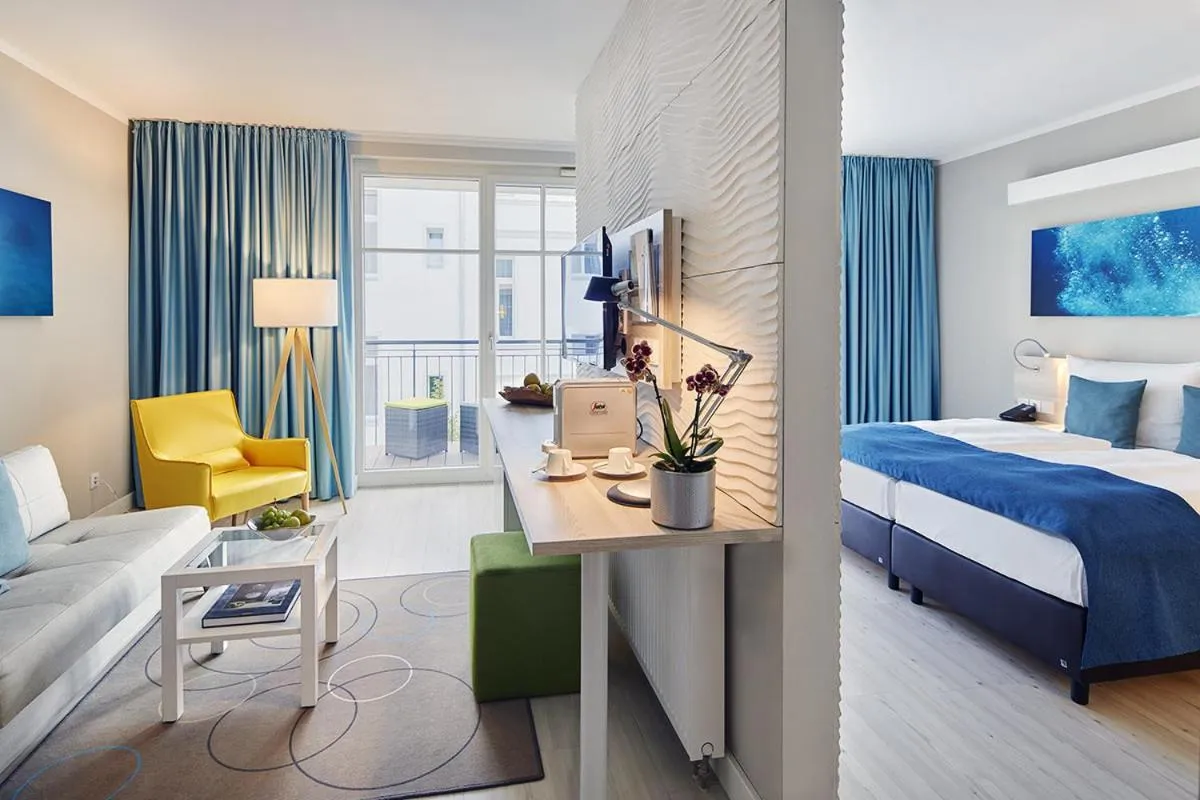 Photo of the whole room, Bed in SEETELHOTEL Kaiserstrand Beachhotel das Lifestyle-Hotel direkt am Strand