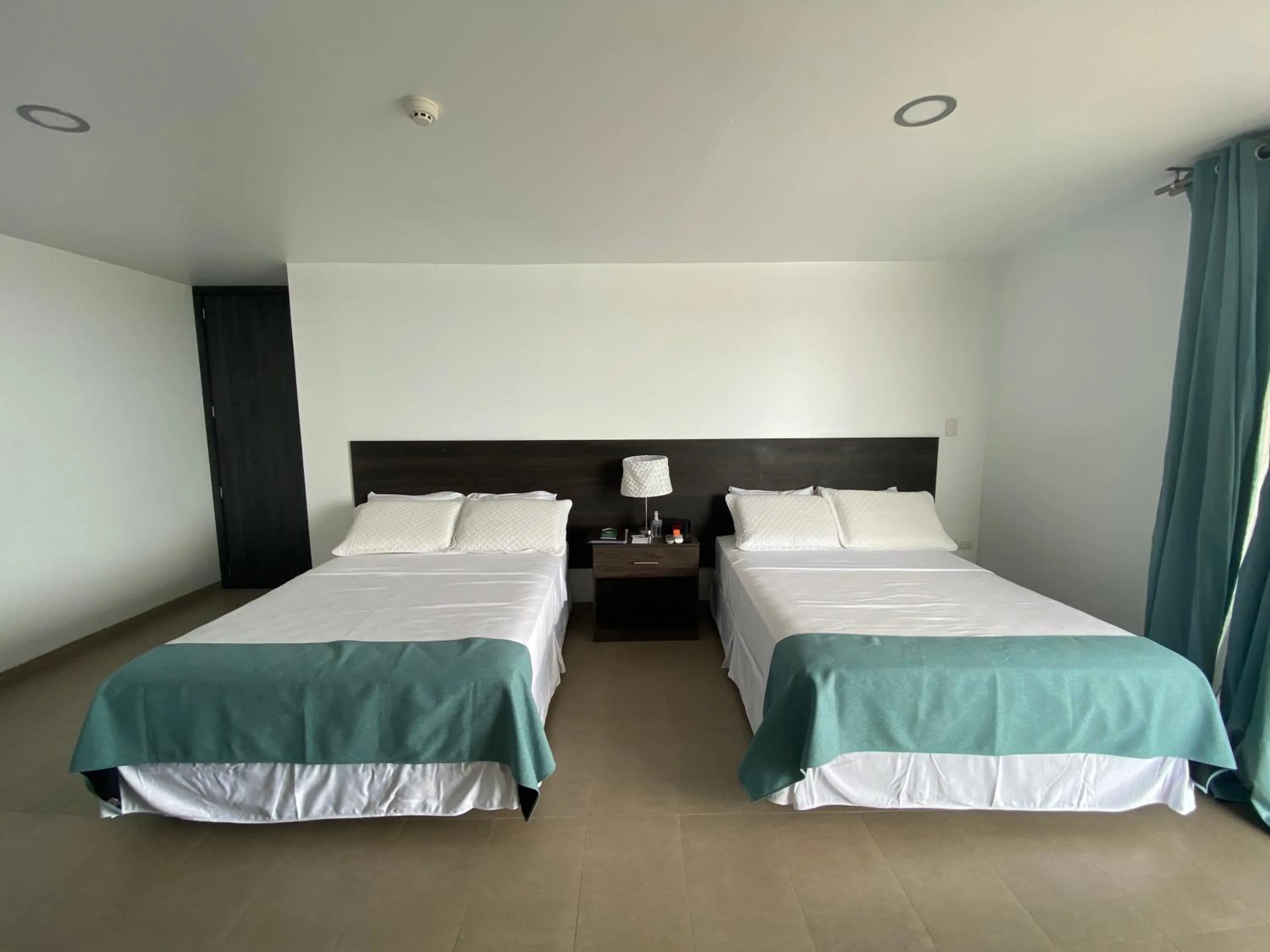 Bed in Galapagos Sunset Hotel