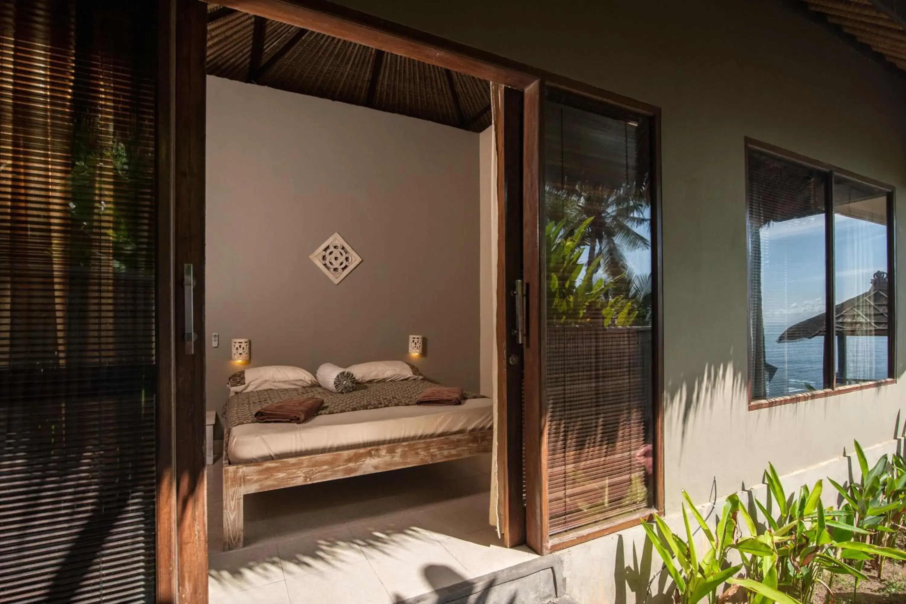 Bedroom in Relax Bali Resort, Diving & SPA, ocean front Bedroom in Relax Bali Resort, Diving & SPA, ocean front