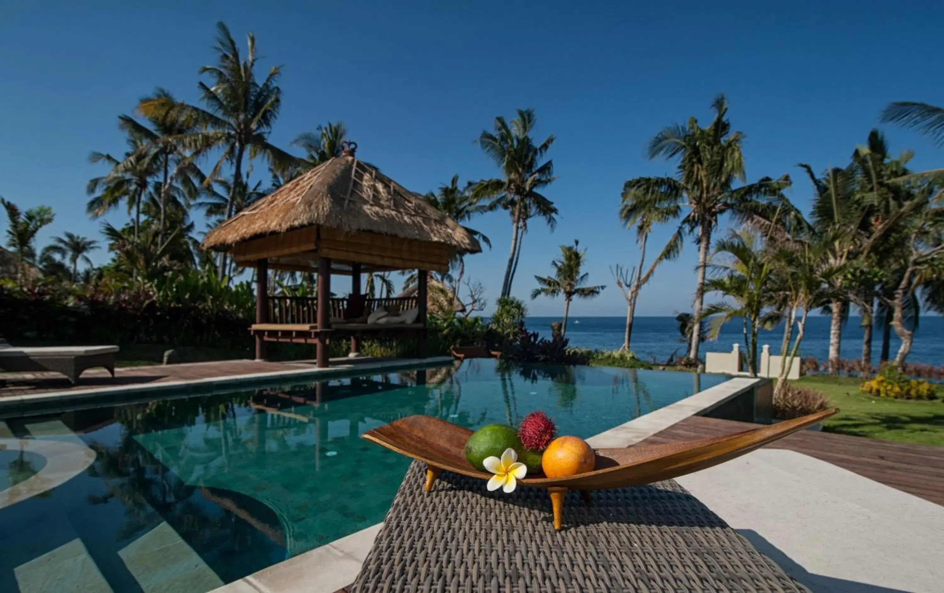 Swimming pool in Relax Bali Resort, Diving & SPA, ocean front Swimming pool in Relax Bali Resort, Diving & SPA, ocean front