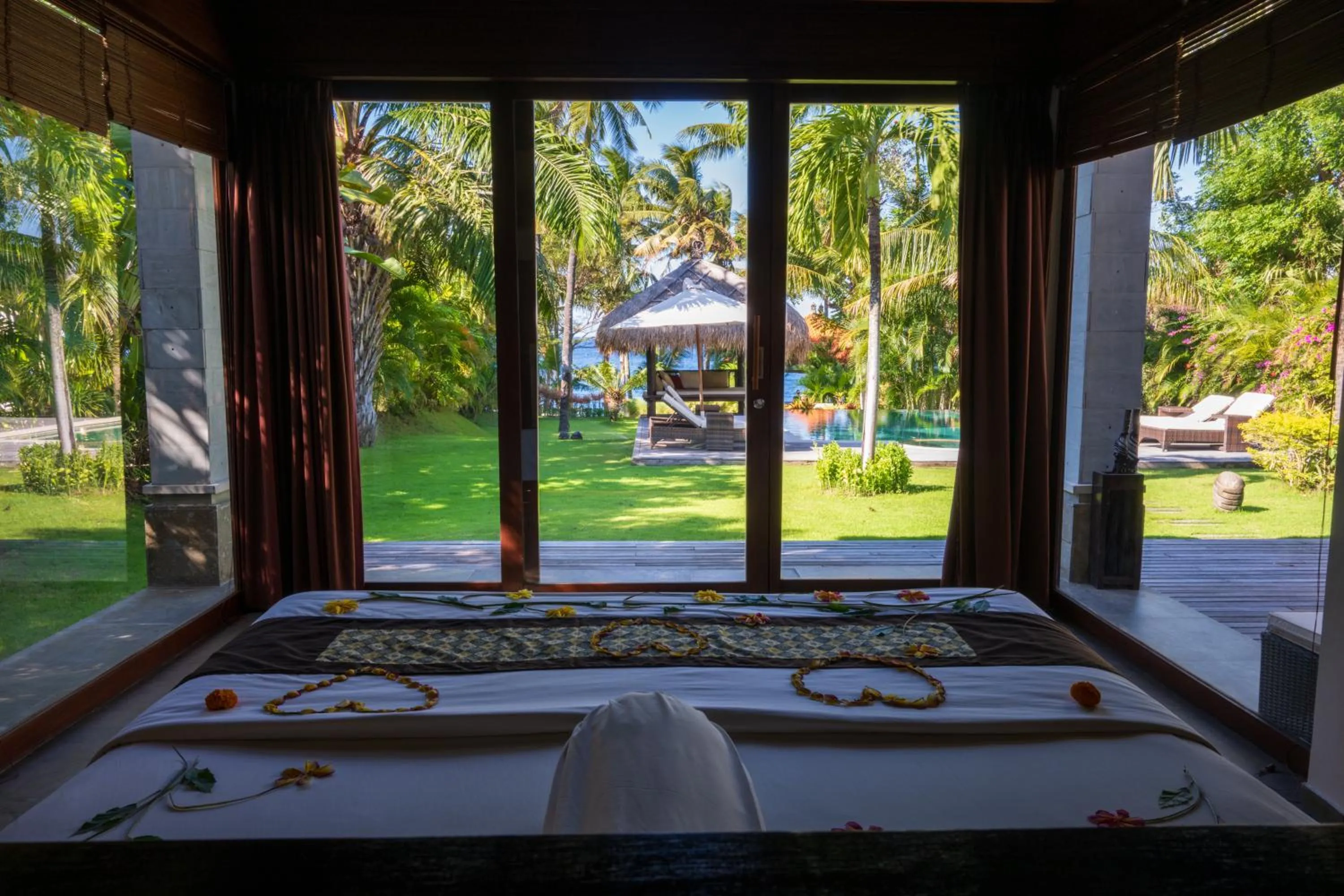 Bed in Relax Bali Dive & SPA ocean front resort