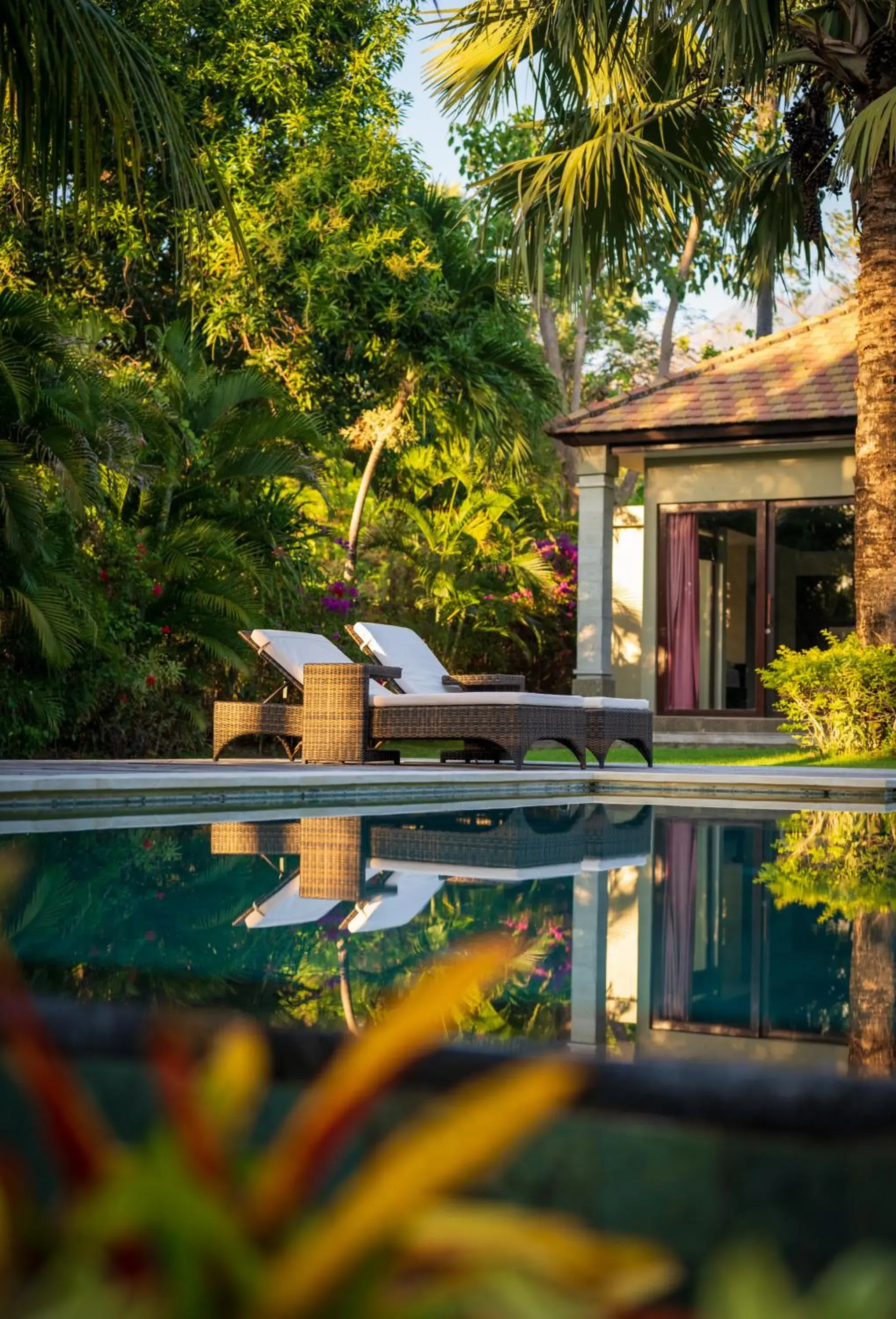 Swimming pool in Relax Bali Resort, Diving & SPA, ocean front Swimming pool in Relax Bali Resort, Diving & SPA, ocean front