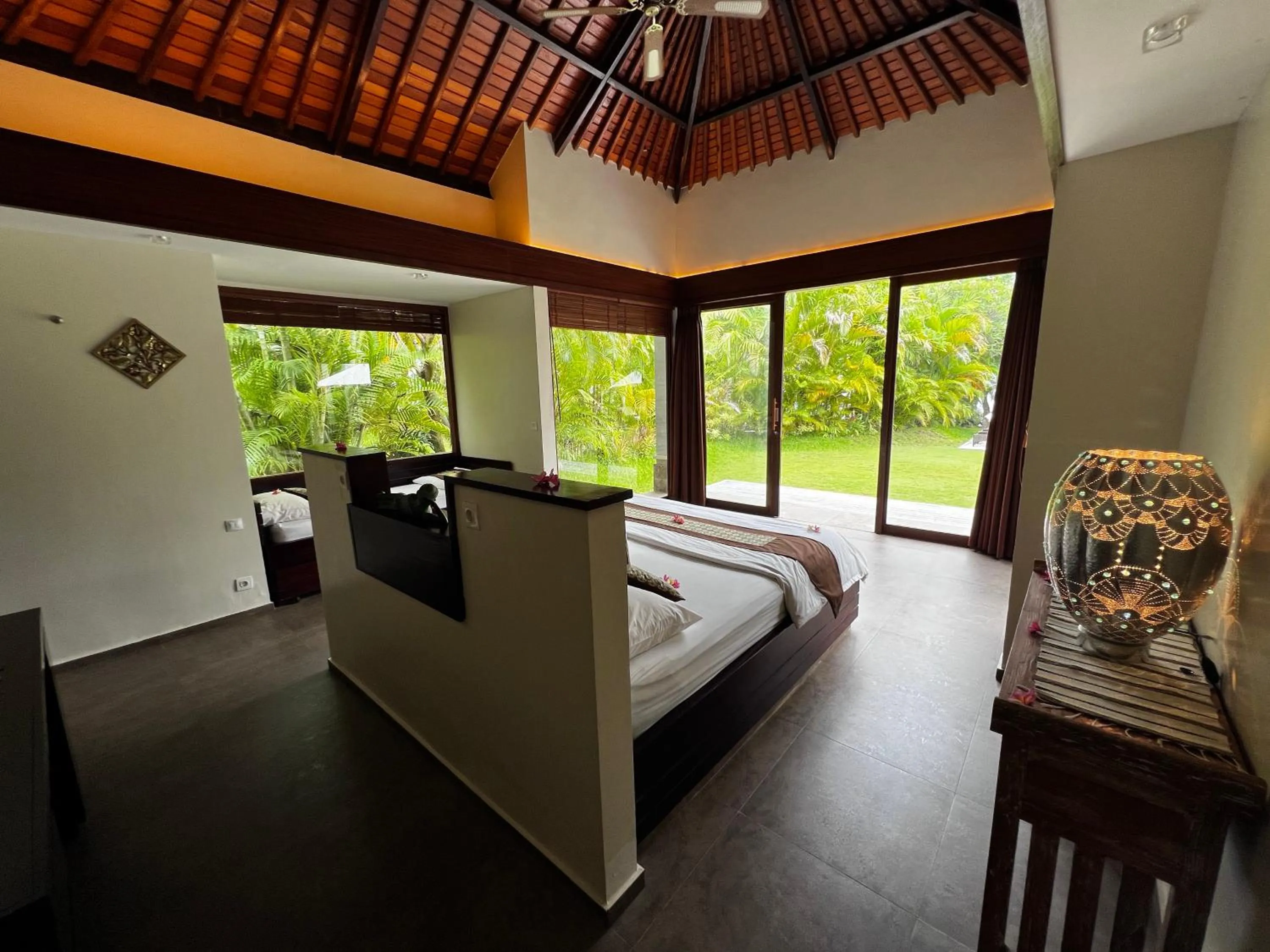 Bed in Relax Bali Dive & SPA ocean front resort