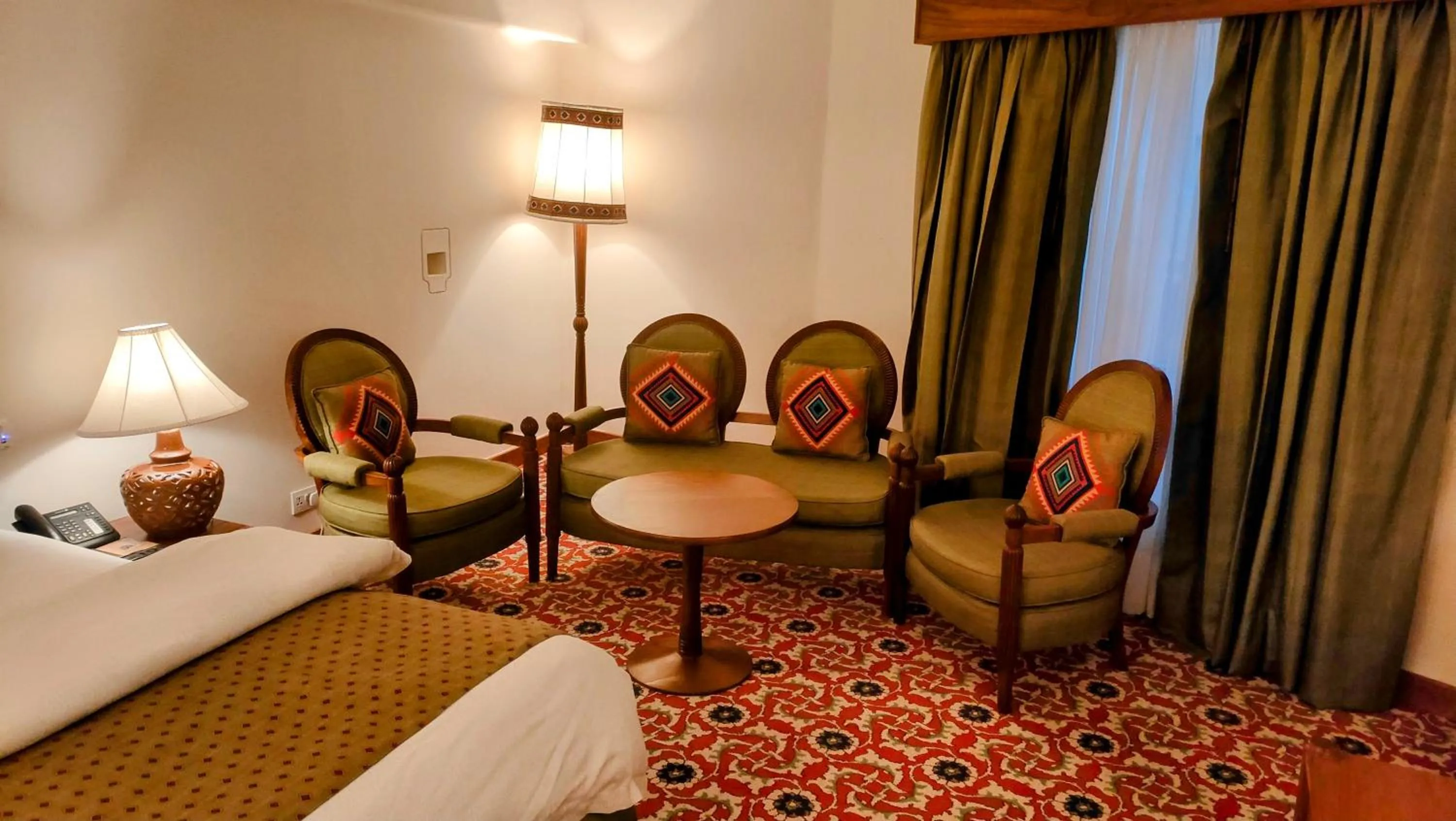 Seating area, Bed in Quetta Serena Hotel