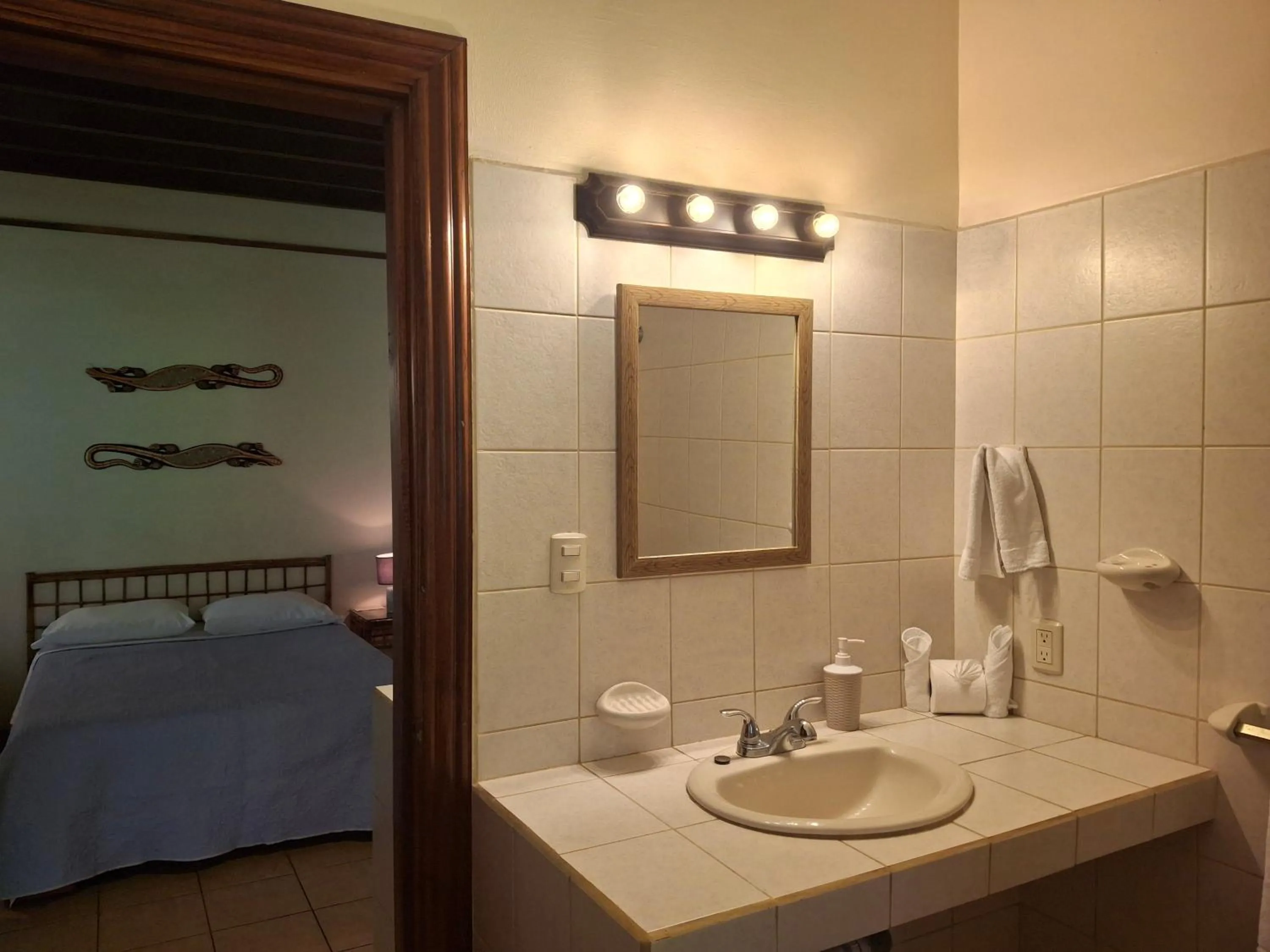 Bathroom, Bed in Playa Negra Guesthouse