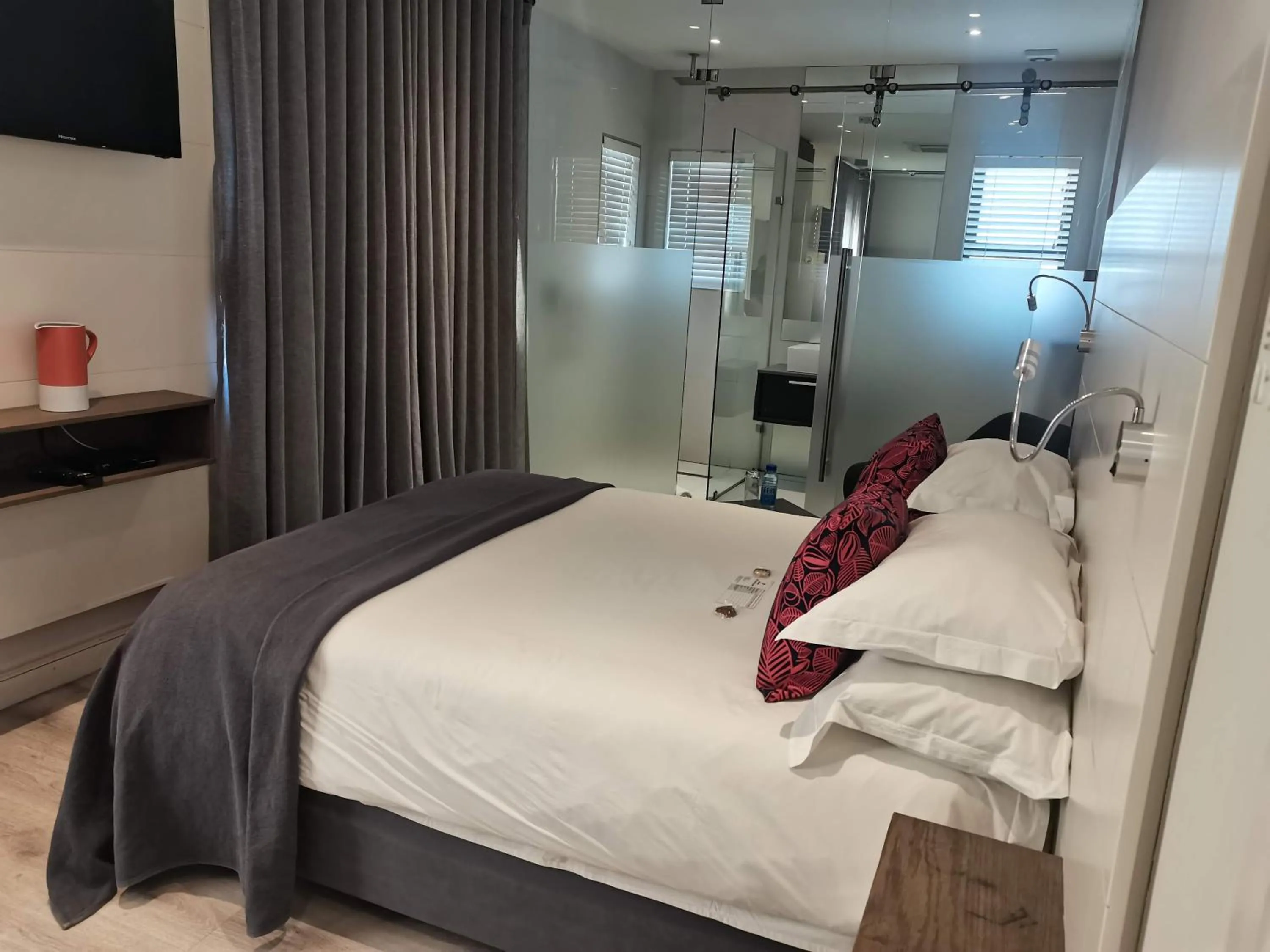 Bed in The Paralian Exclusive Guest House