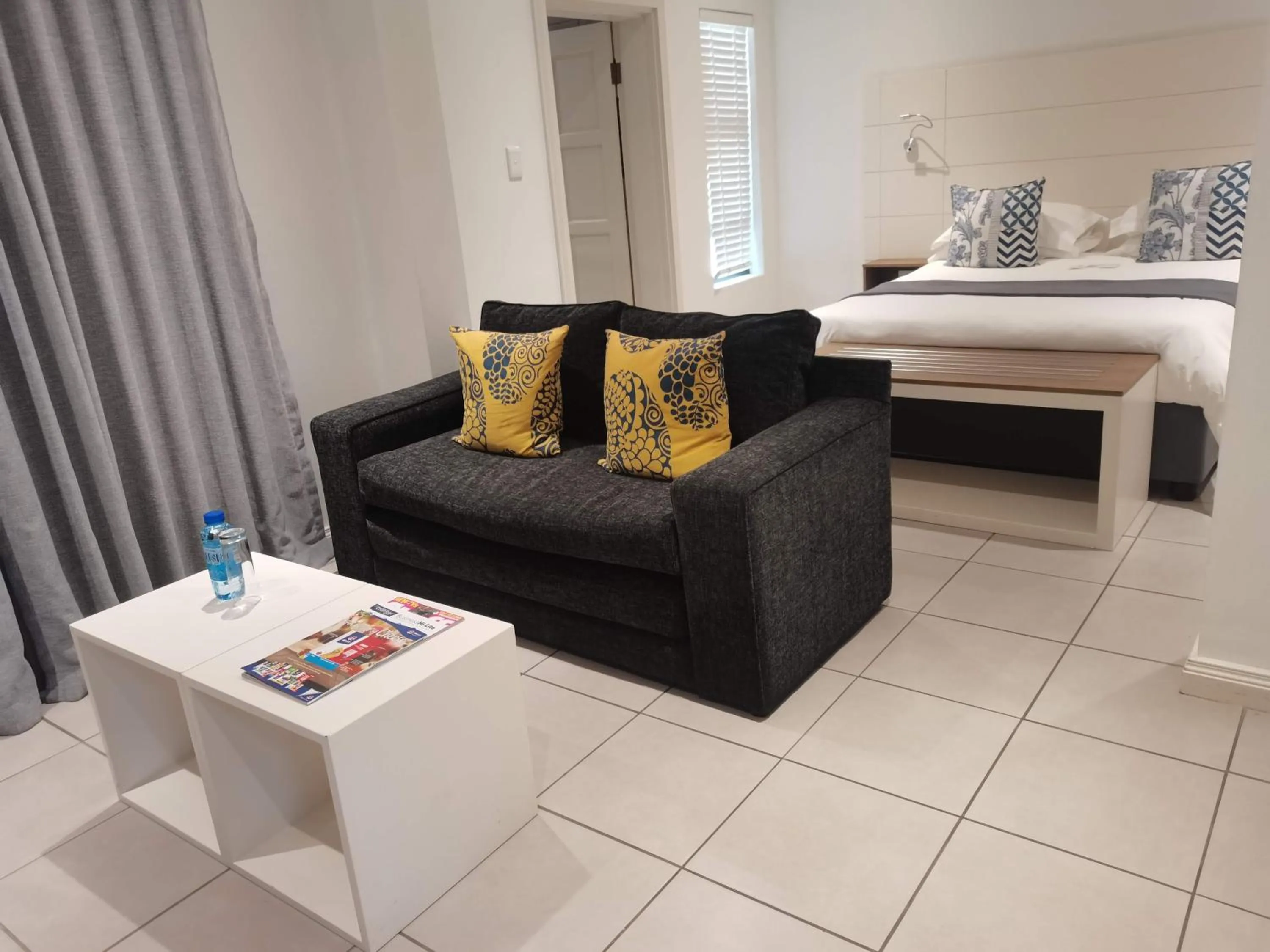 Seating area, Bed in The Paralian Exclusive Guest House