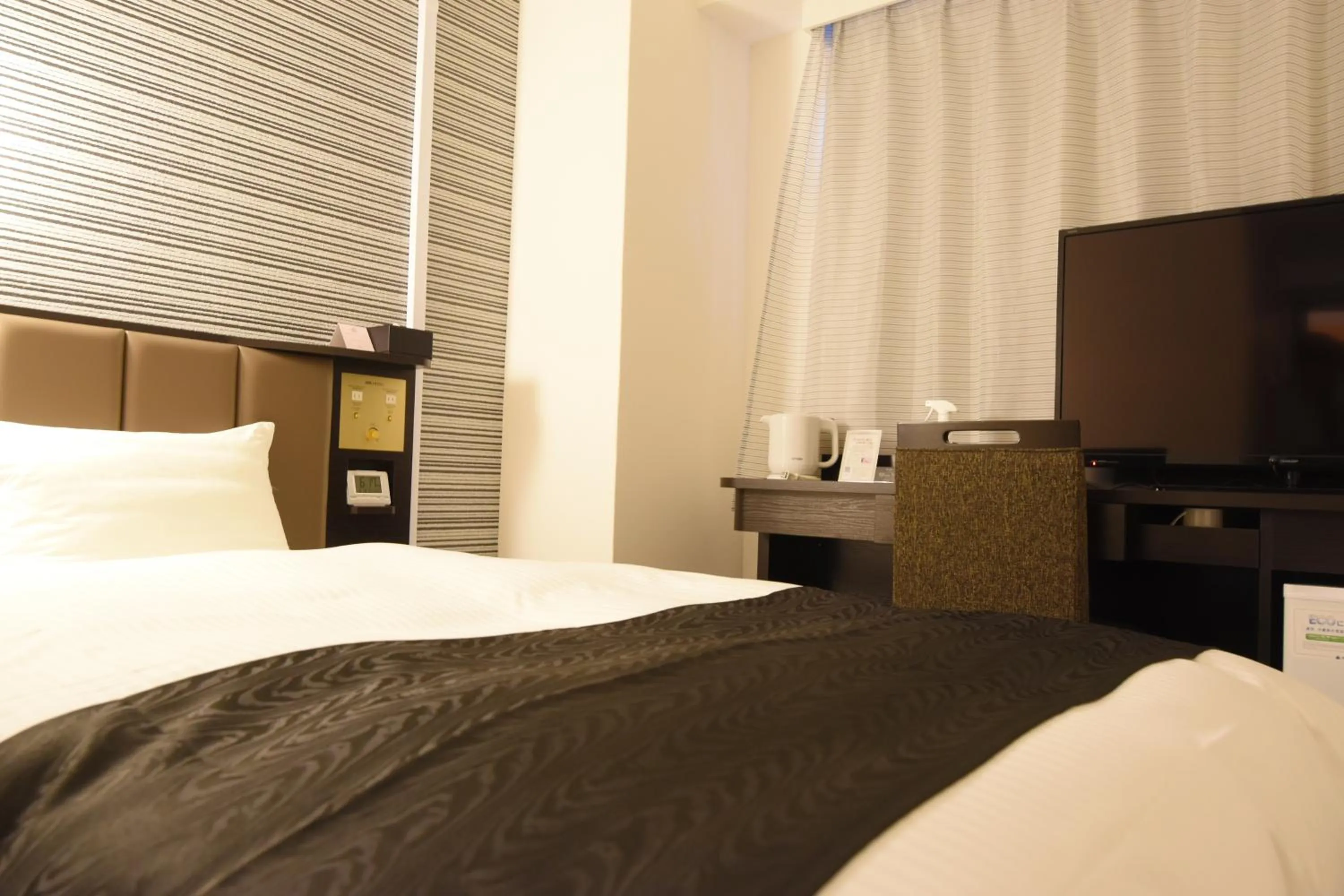 Photo of the whole room, Bed in APA Hotel Kagoshima Tenmonkan