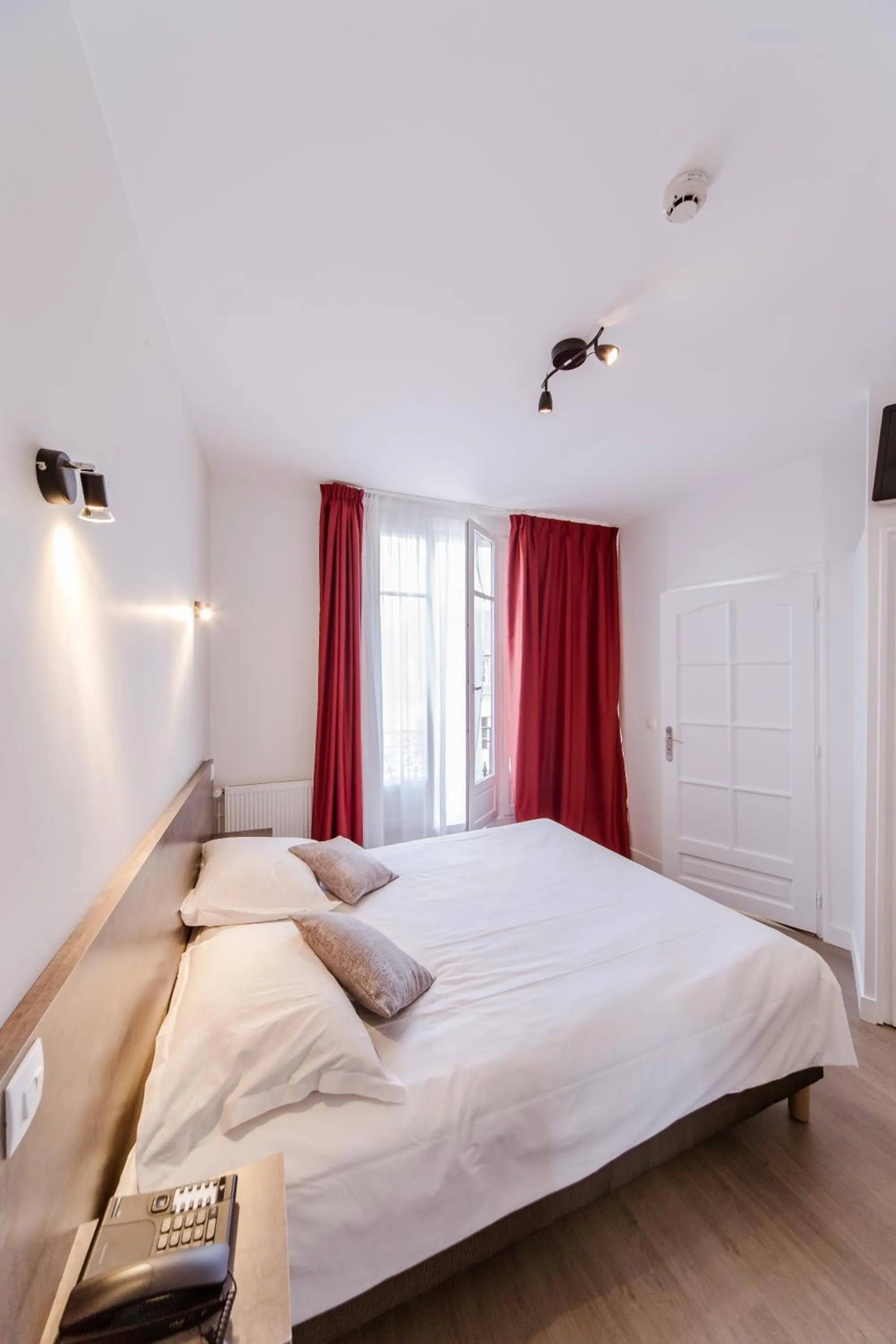 Bed in LOGIS HOTEL - Le Petit Bellon