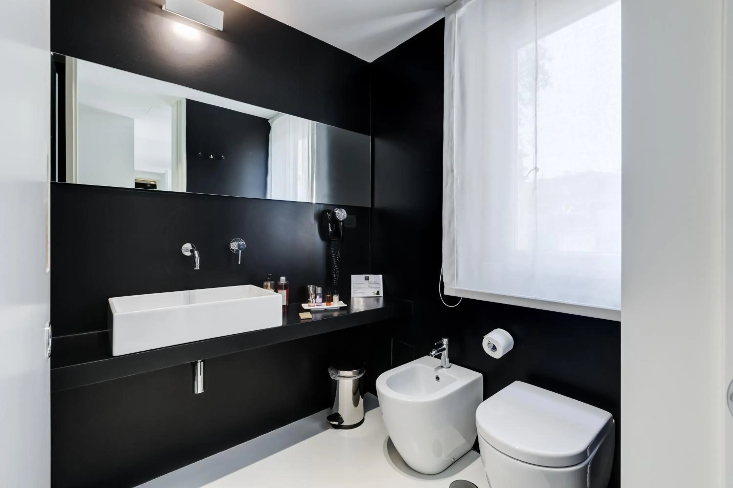 Toilet in Sora Luxury Inn