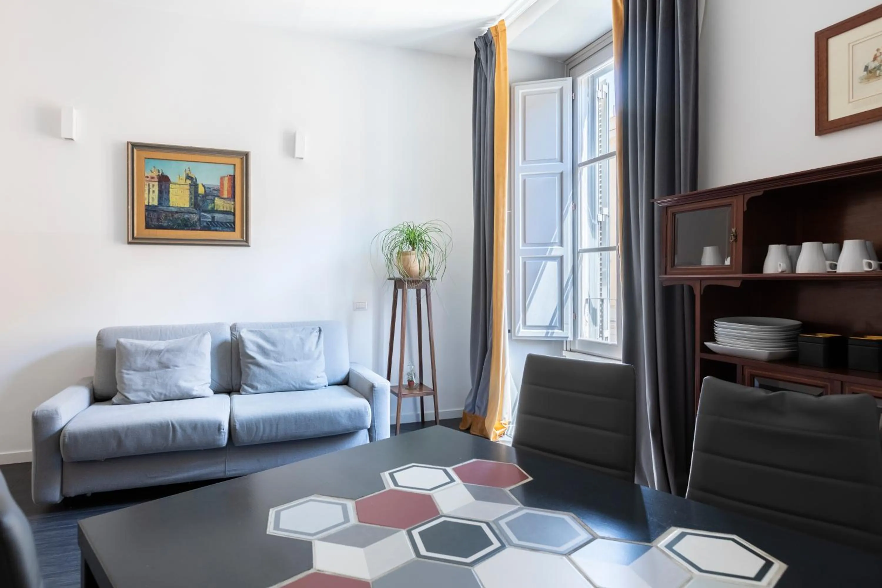 Living room in Vatican City Suites by Hili