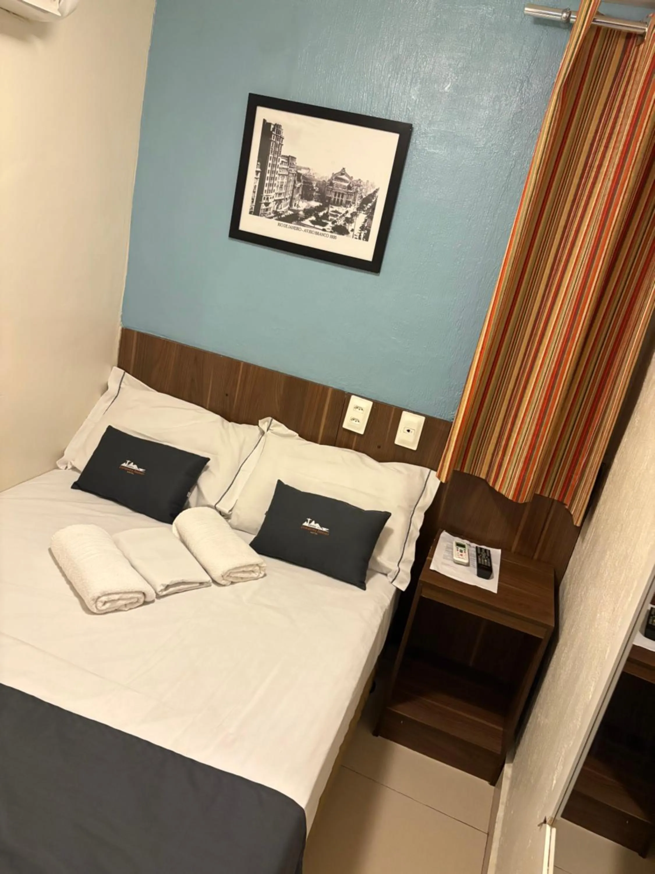 Photo of the whole room, Bed in Downtown Santana Hotel