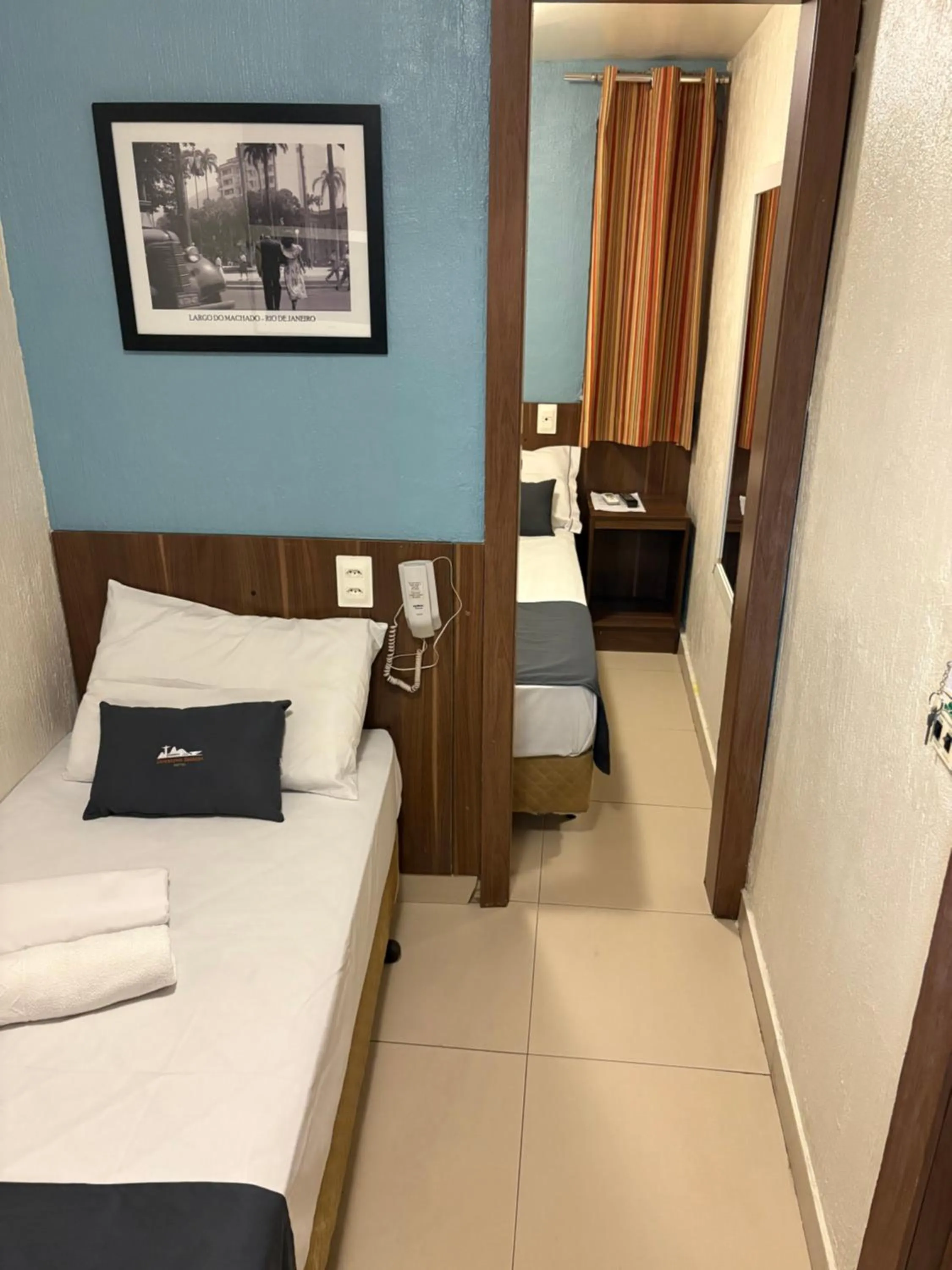 Photo of the whole room, Bed in Downtown Santana Hotel