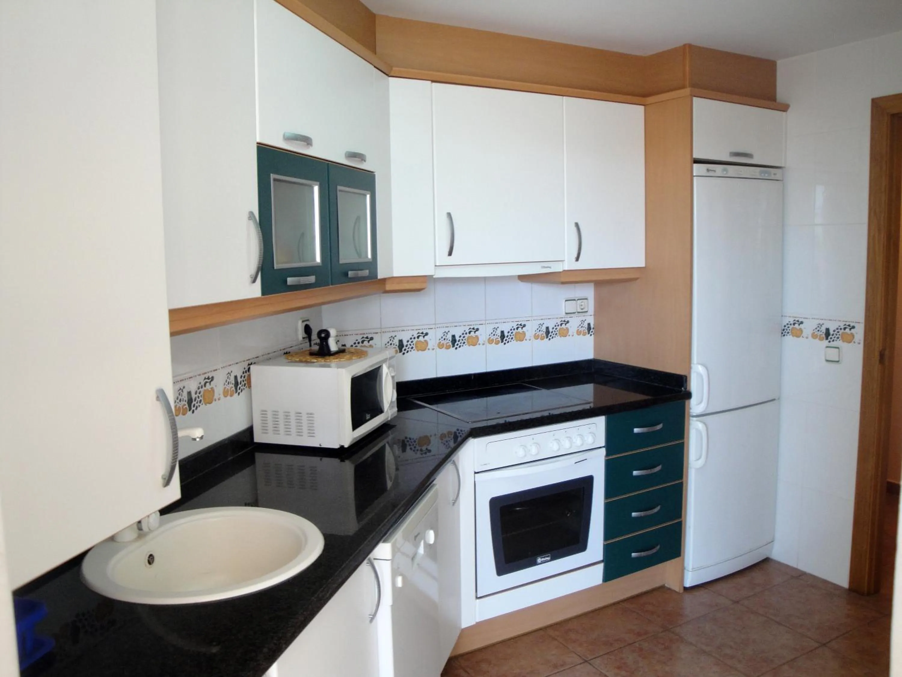 Kitchen or kitchenette in Apartamentos Argenta Caleta 3000