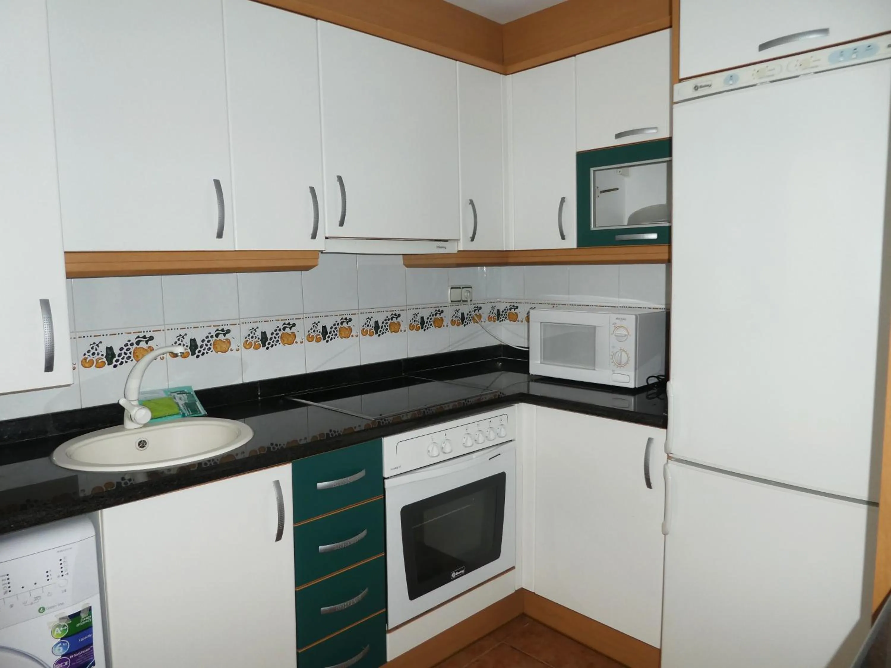 Kitchen or kitchenette in Apartamentos Argenta Caleta 3000