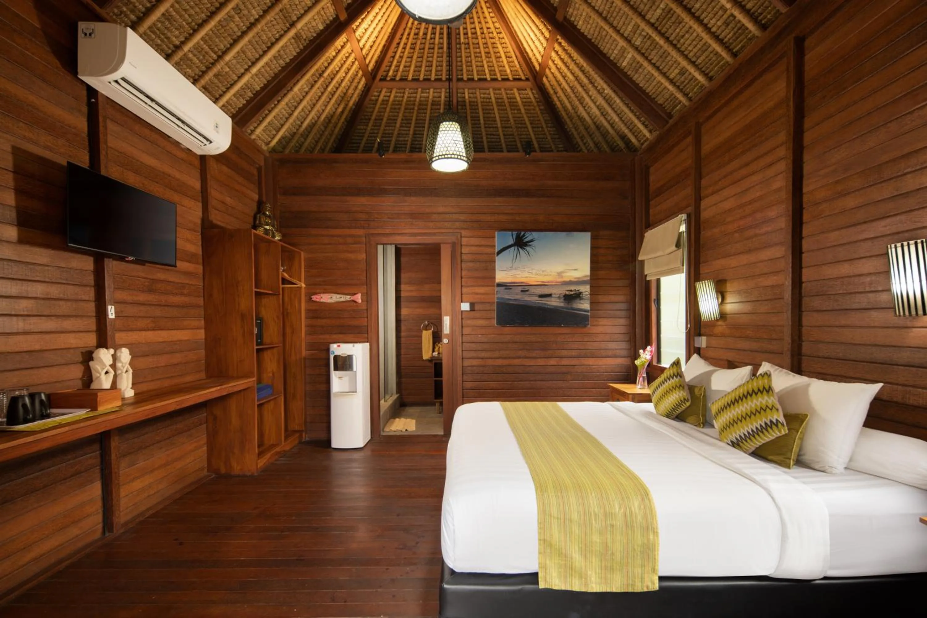 Bed in Gecko Villa & Bungalows