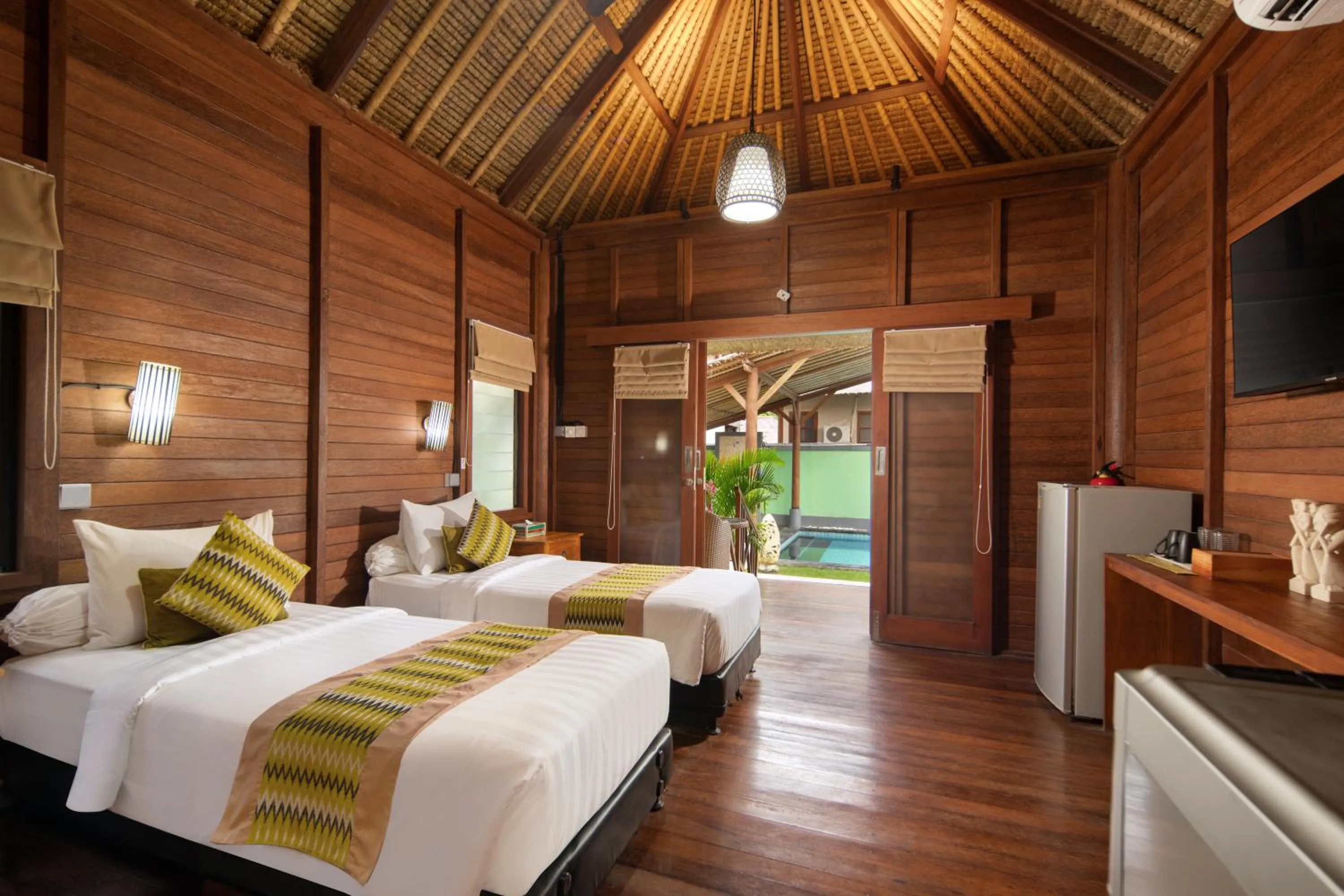 Bed in Gecko Villa & Bungalows