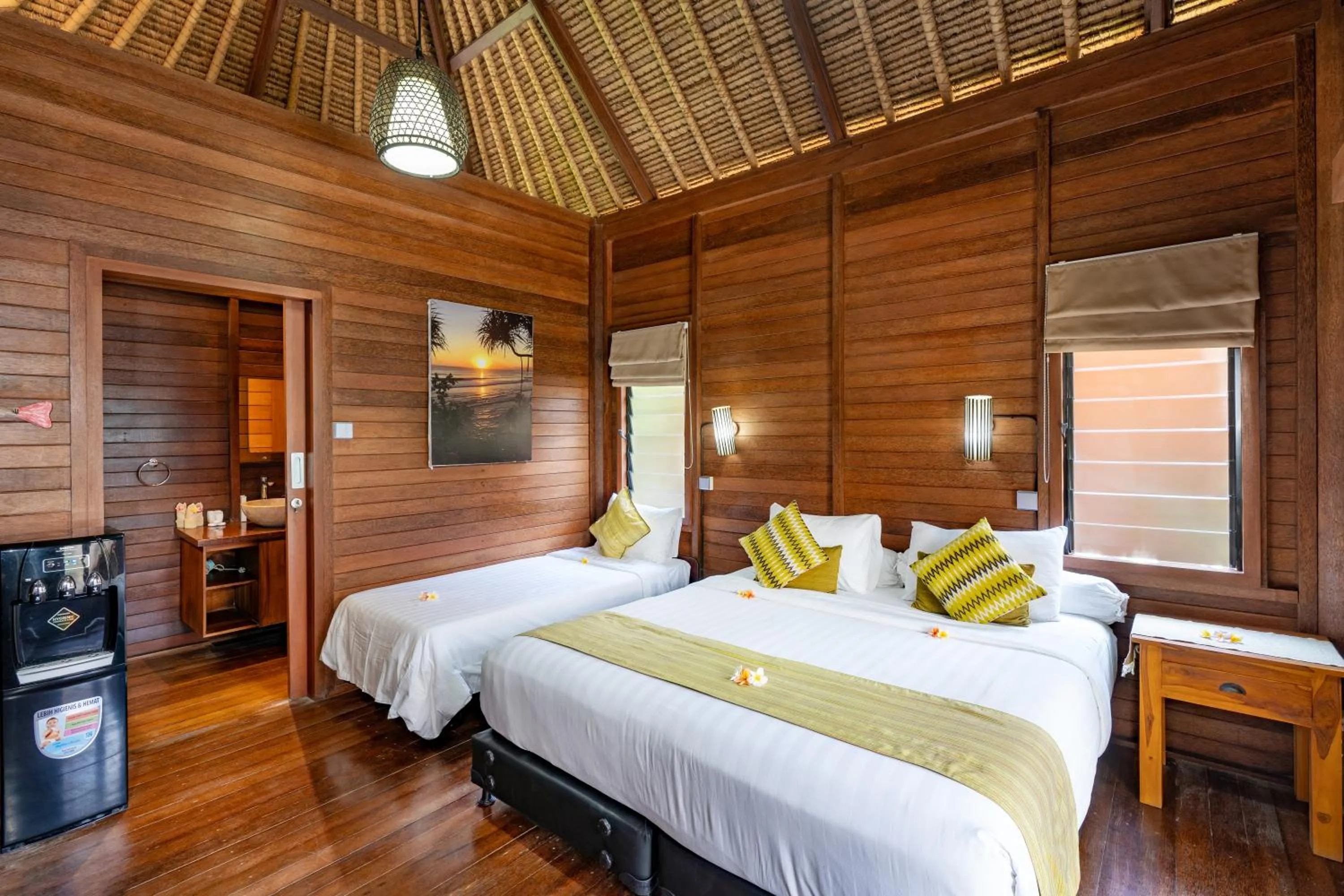 Bed in Gecko Villa & Bungalows