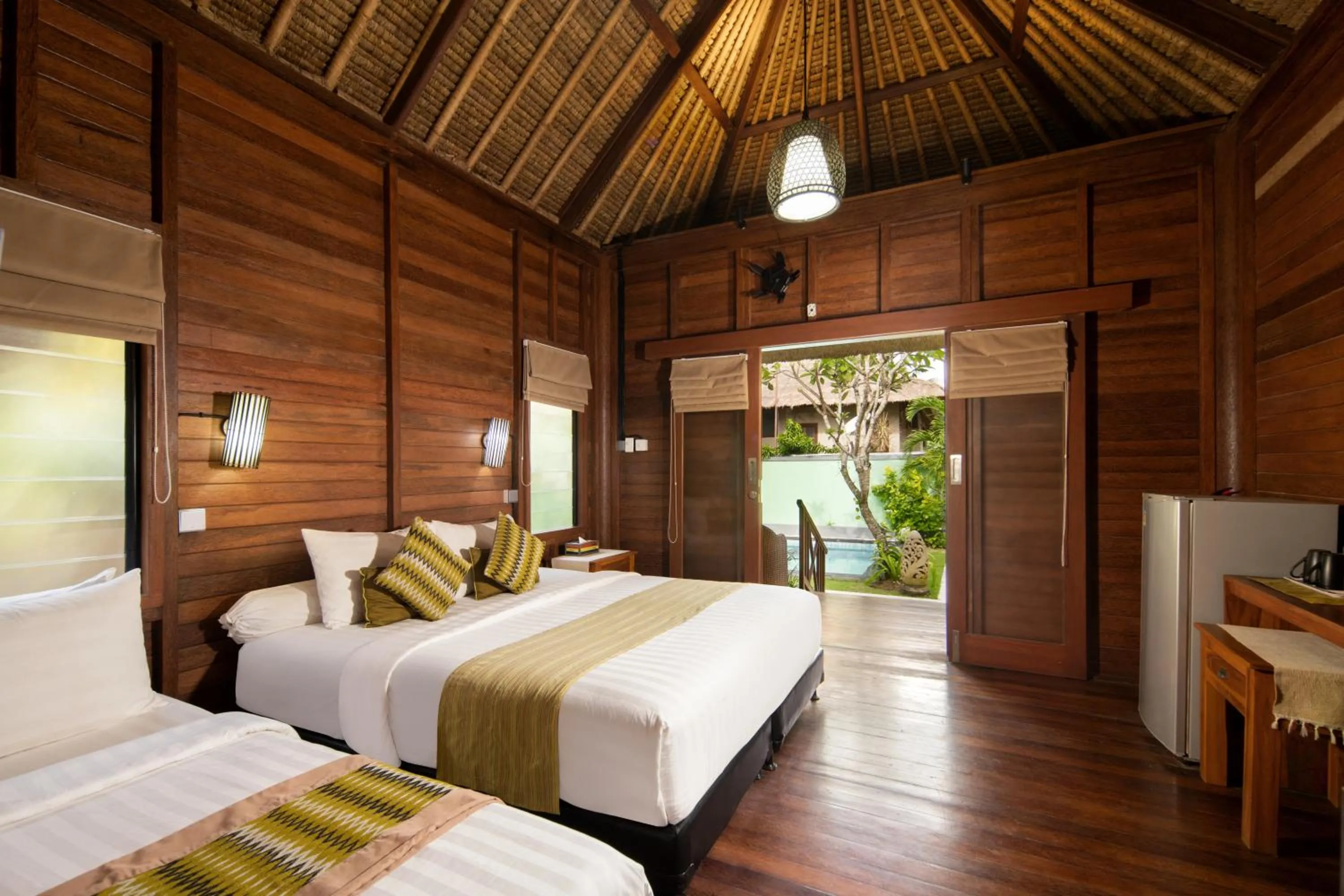 Bed in Gecko Villa & Bungalows