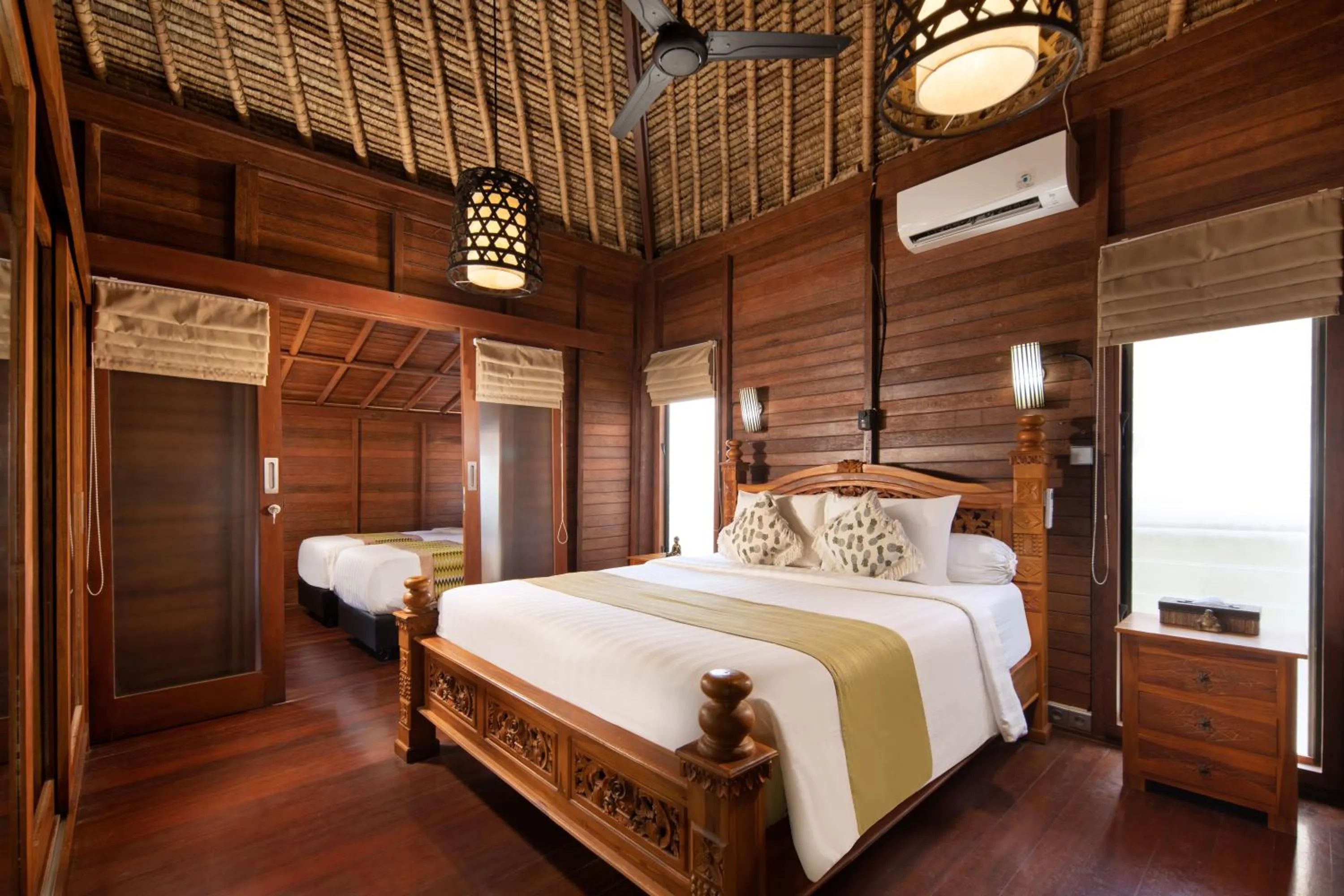 Bed in Gecko Villa & Bungalows