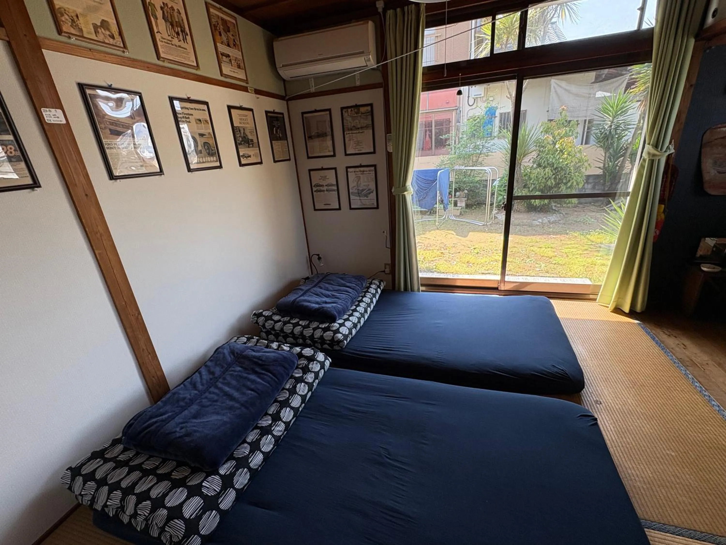 Bed in Norishicoauto Guesthouse