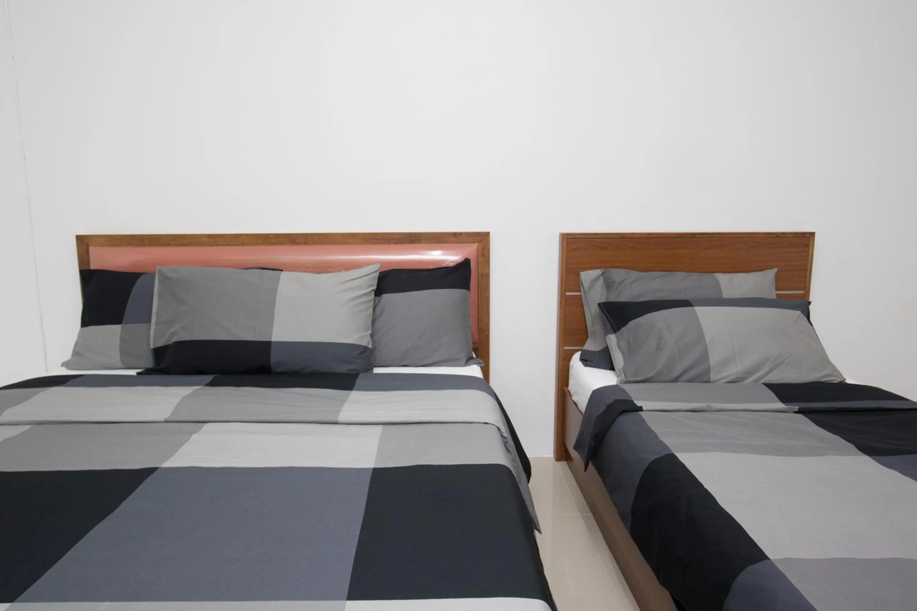 Bed in I-Home Residence and Hotel