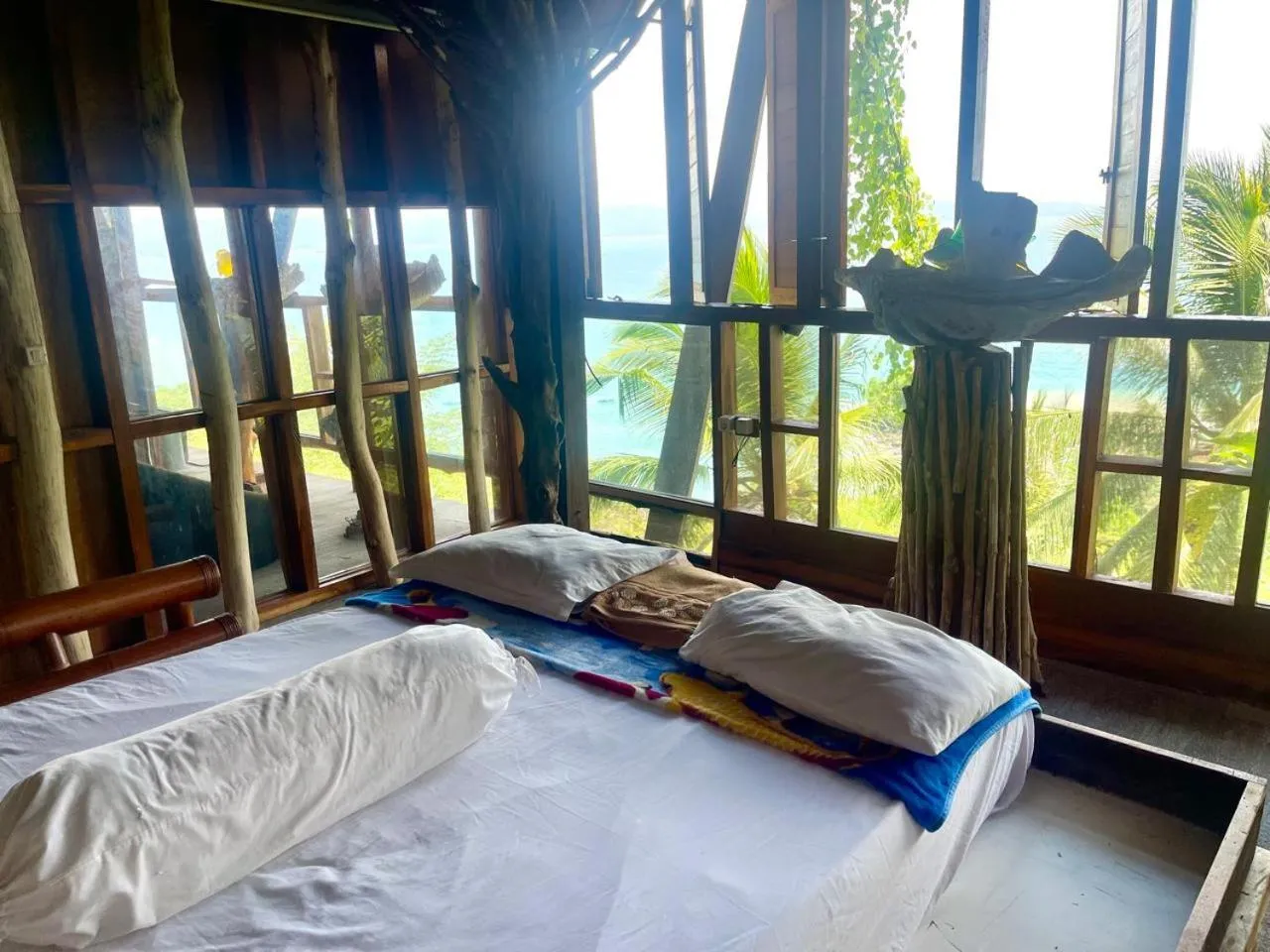 Bed in Karang Aji Beach Villa