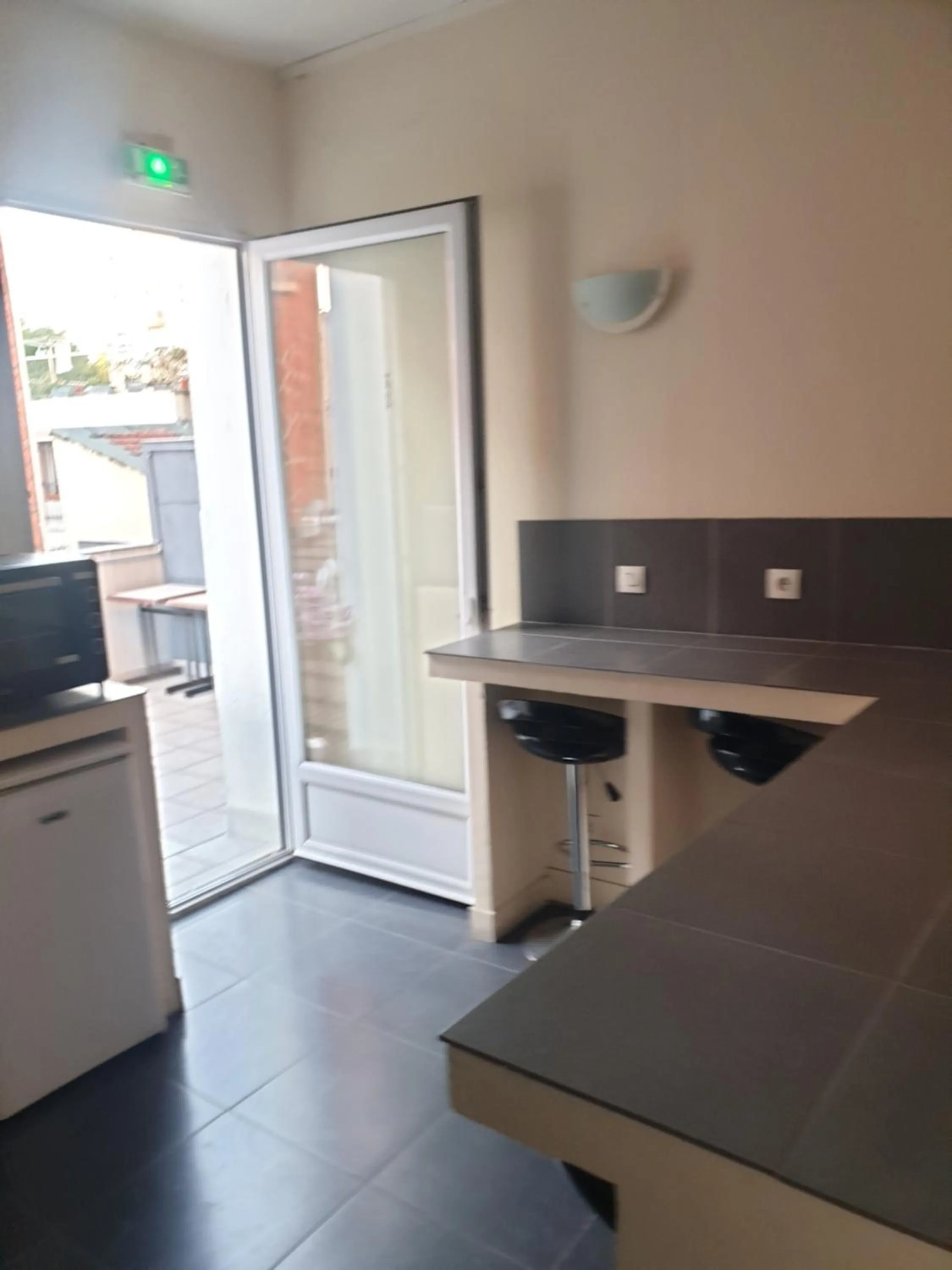 Kitchen or kitchenette in Hôtel Belfort