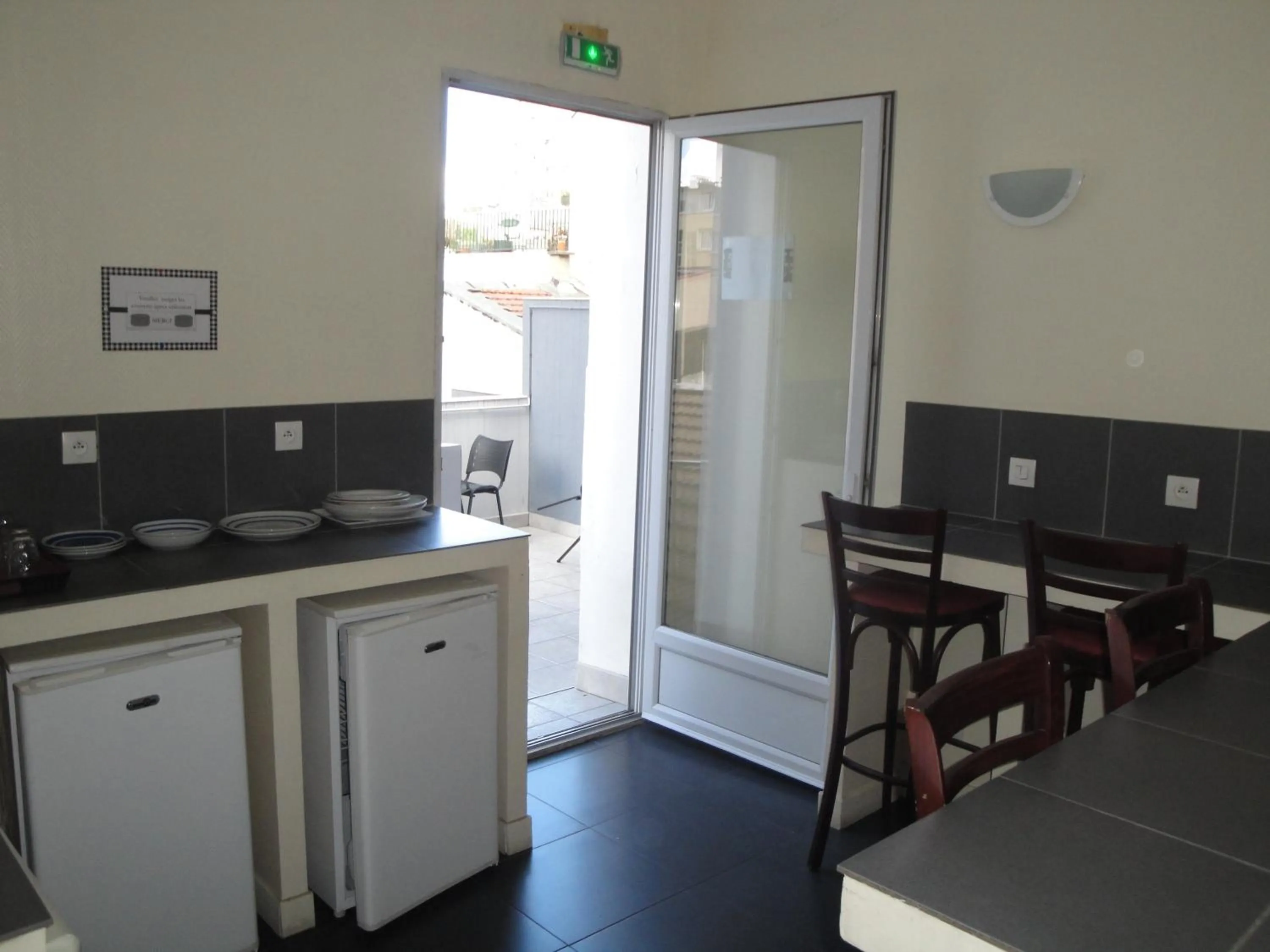 Kitchen or kitchenette in Hôtel Belfort