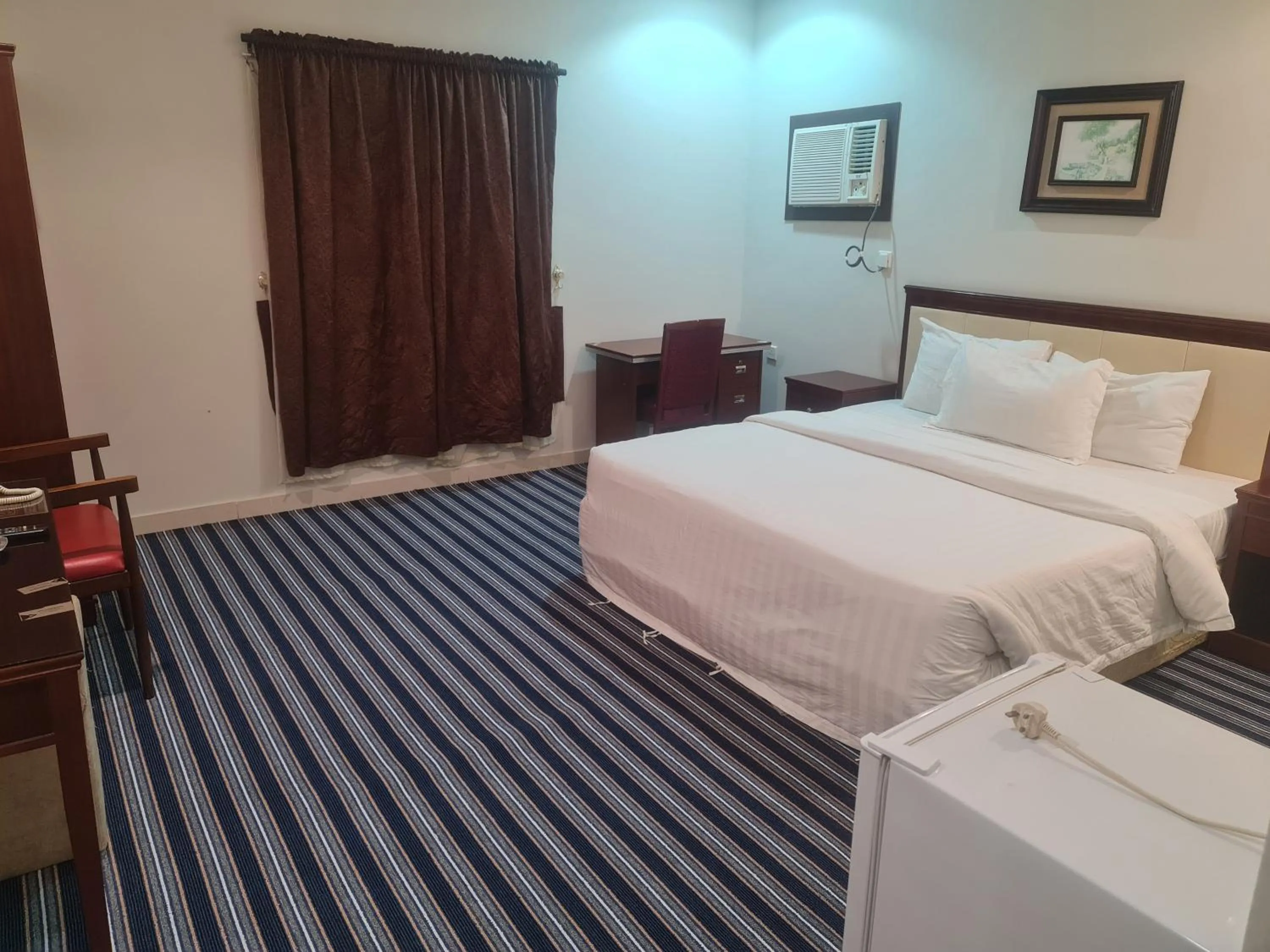 Bed in Makarim Palm Hotel