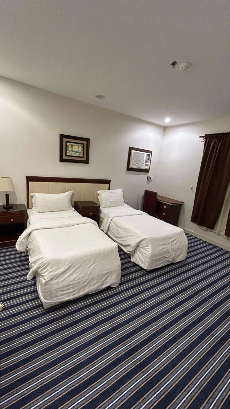 Bed in Makarim Palm Hotel