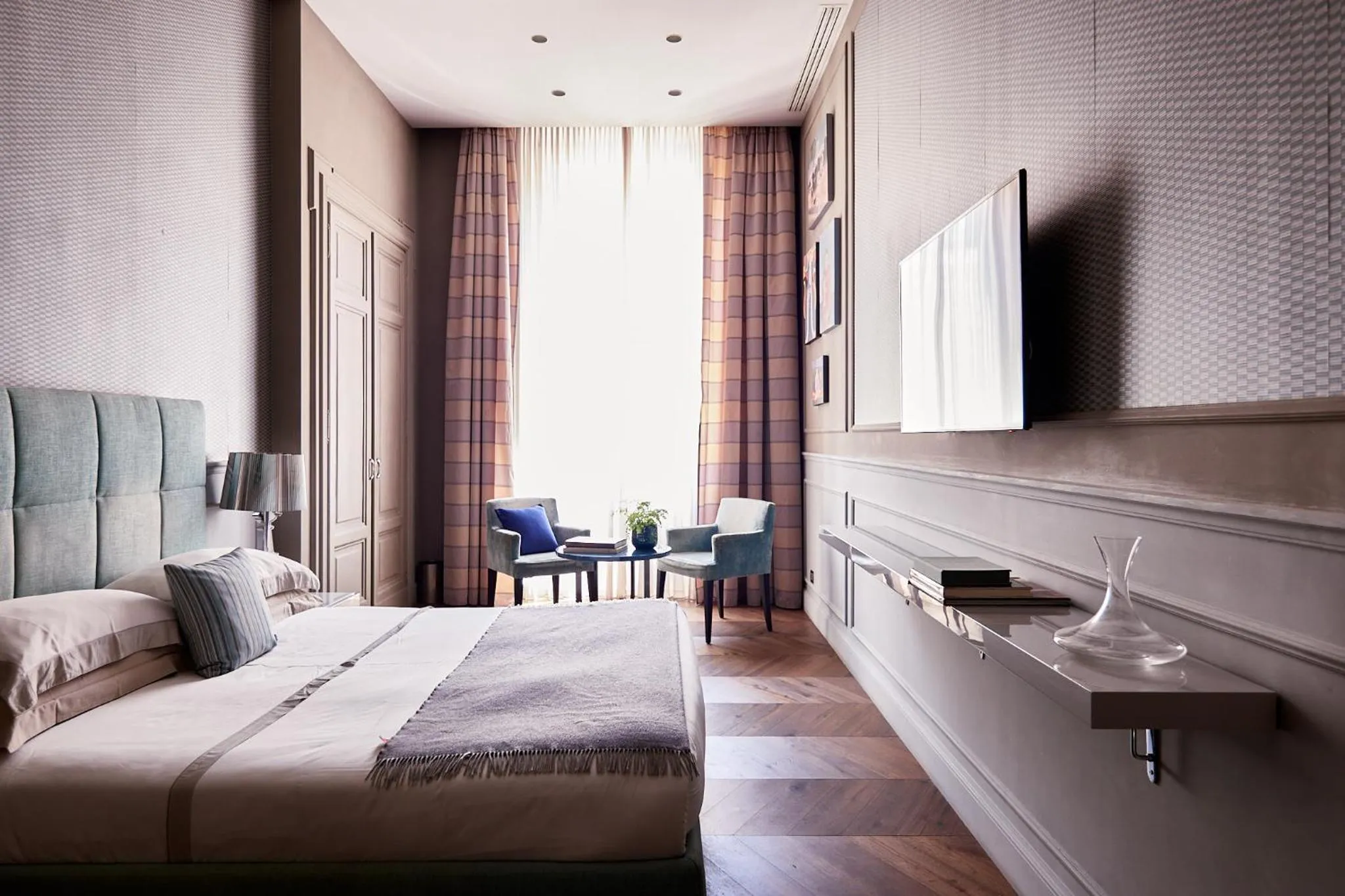 Bed in Le Quattro Dame Luxury Suites