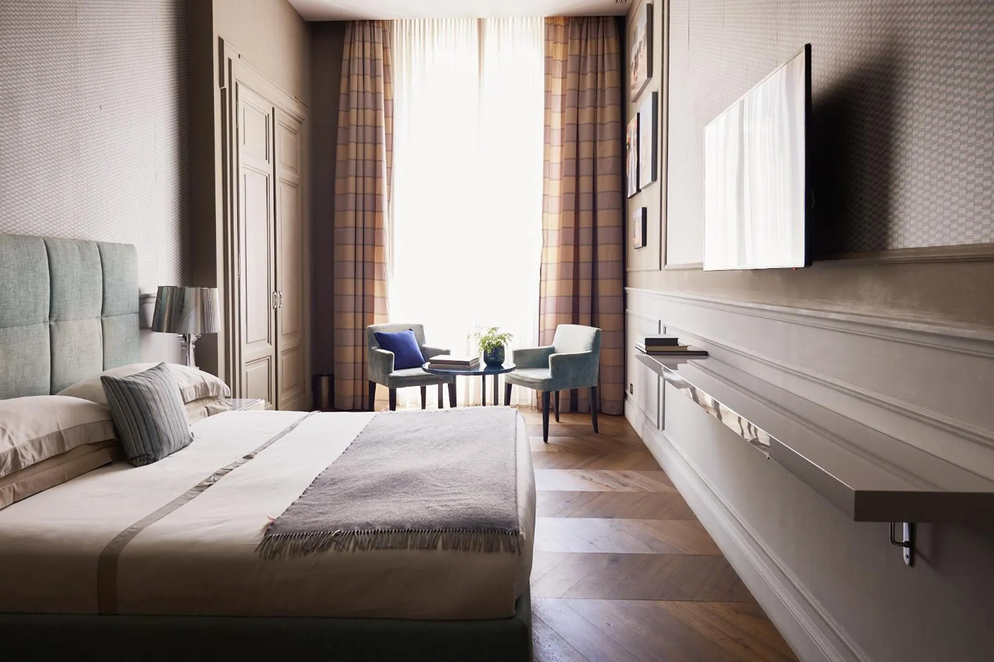 Bed in Le Quattro Dame Luxury Suites