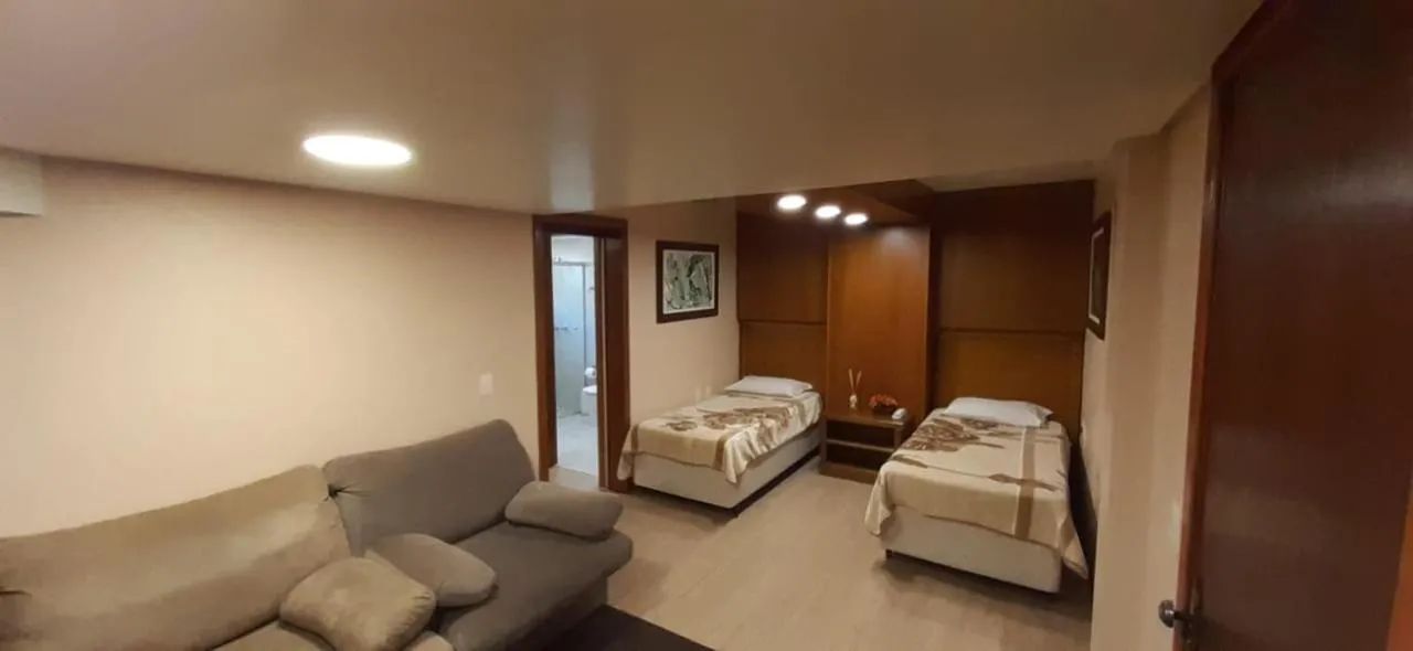 Bed in Pousada Das Papoulas