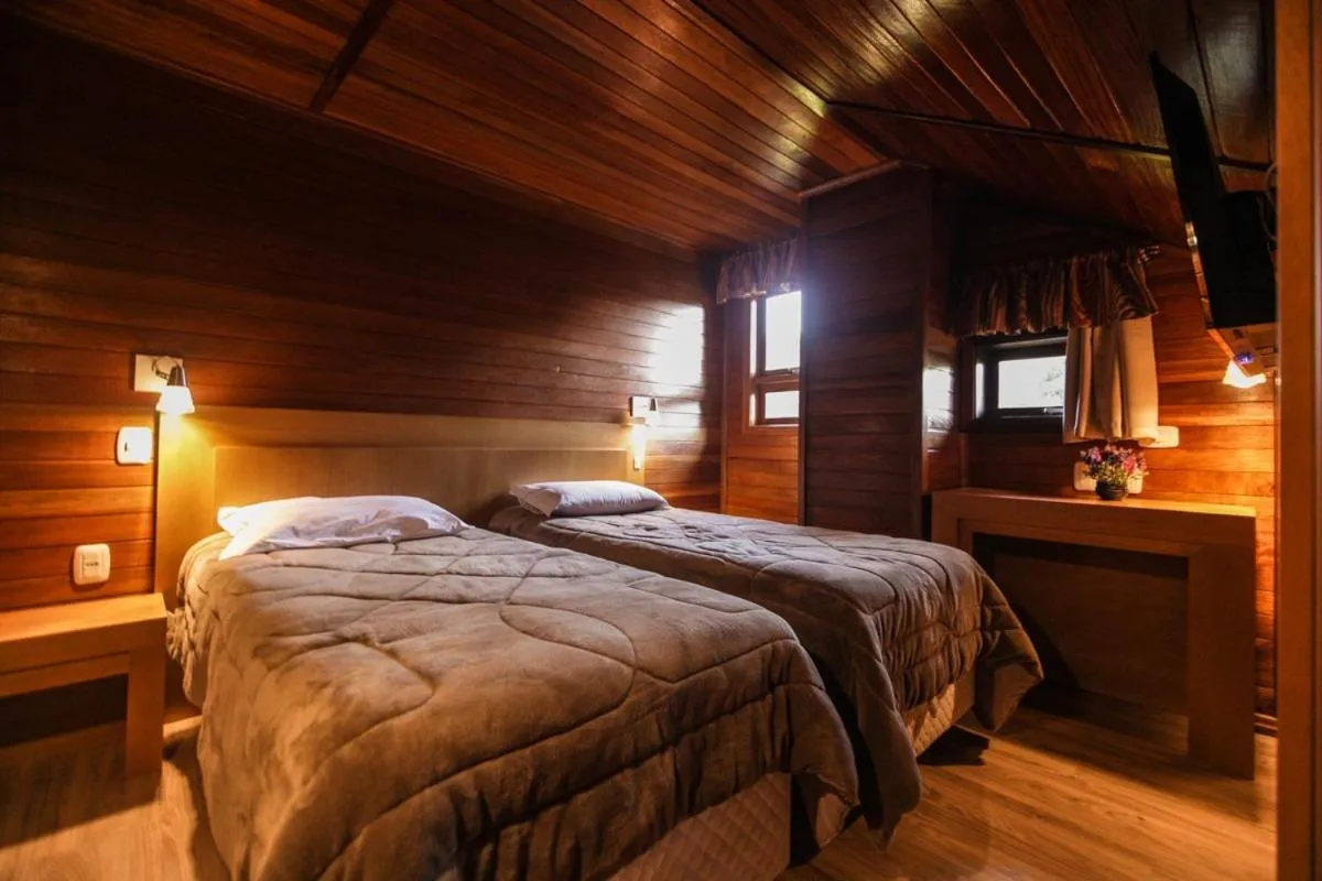 Bed in Pousada Das Papoulas