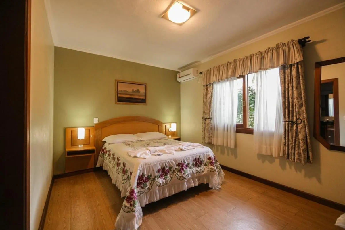 Bed in Pousada Das Papoulas