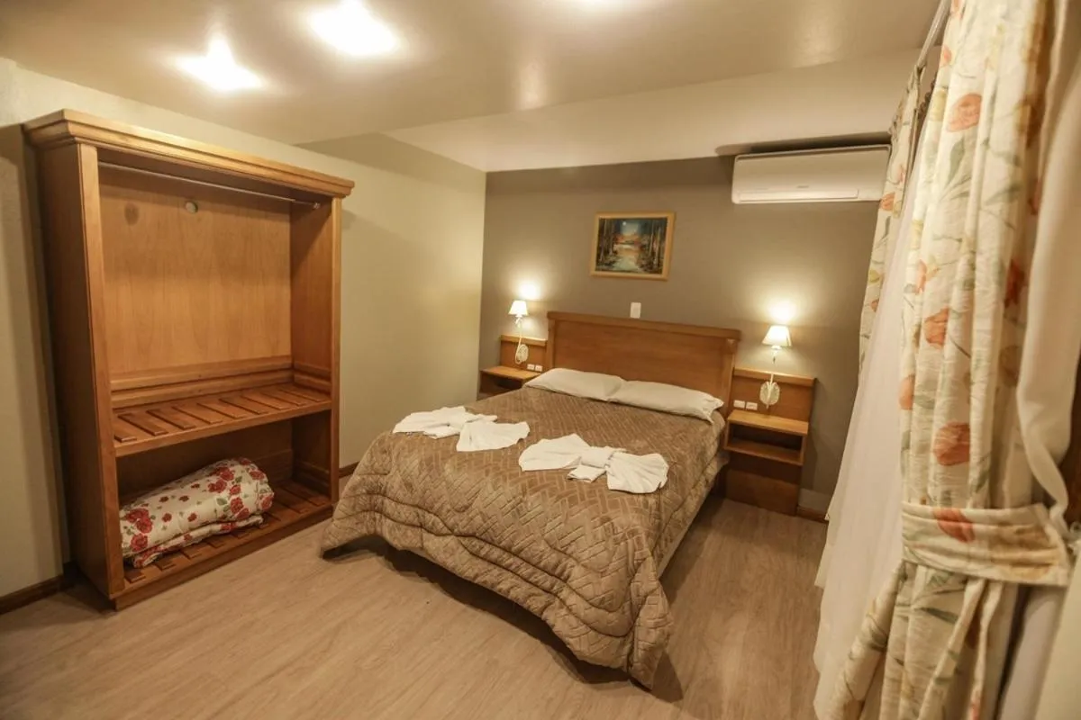 Bed in Pousada Das Papoulas